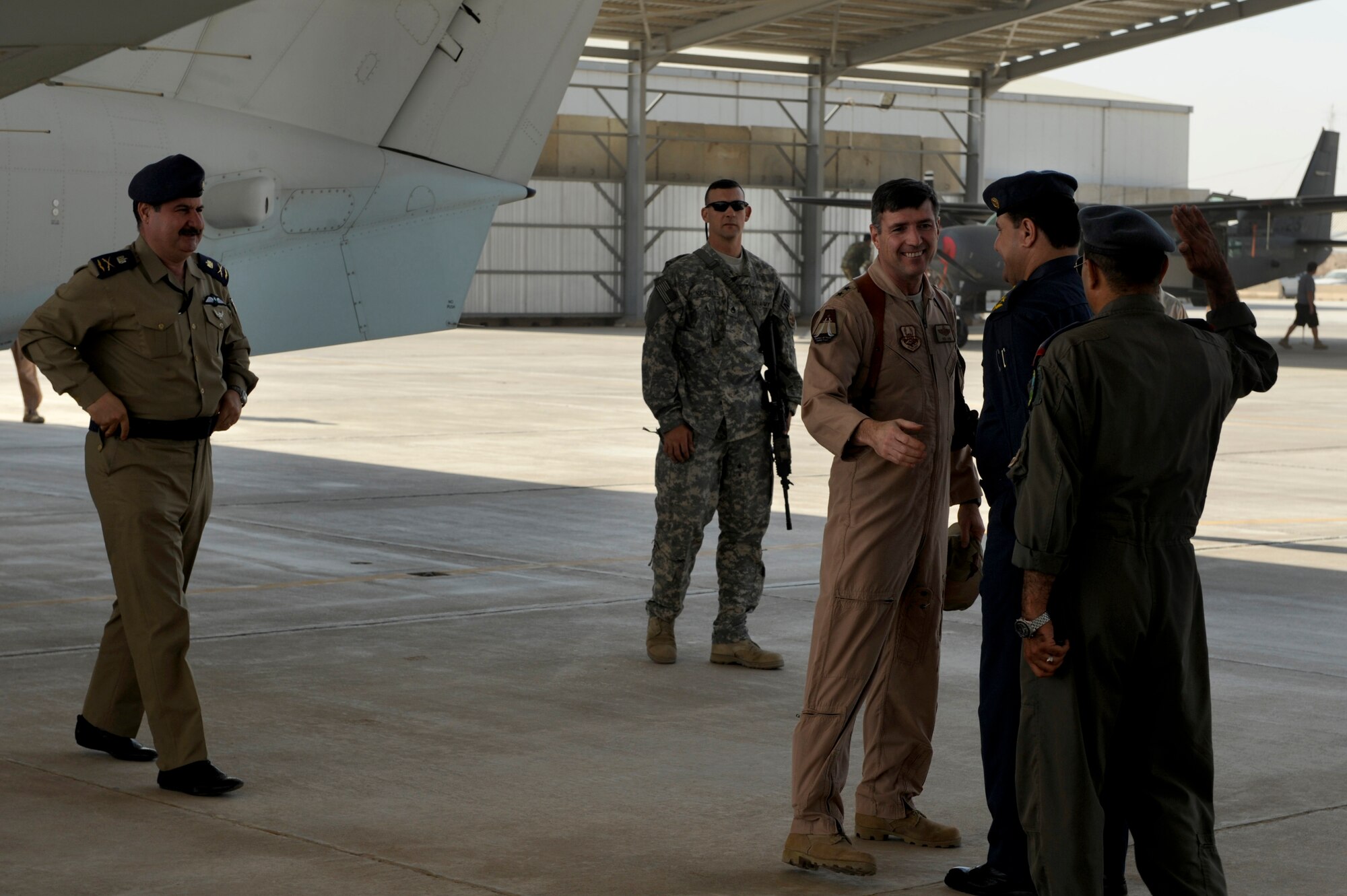 U.S. Air Force Maj. Gen. Robert Kane, Commanding General, Coalition Air Force Transition Team, greets airmen from the Iraqi Air Force's Squadron 3 on the flightline at Kirkuk Air Base, Oct. 21, 2009. (U.S. Air Force photo/Staff Sgt. Michael B. Keller) 
