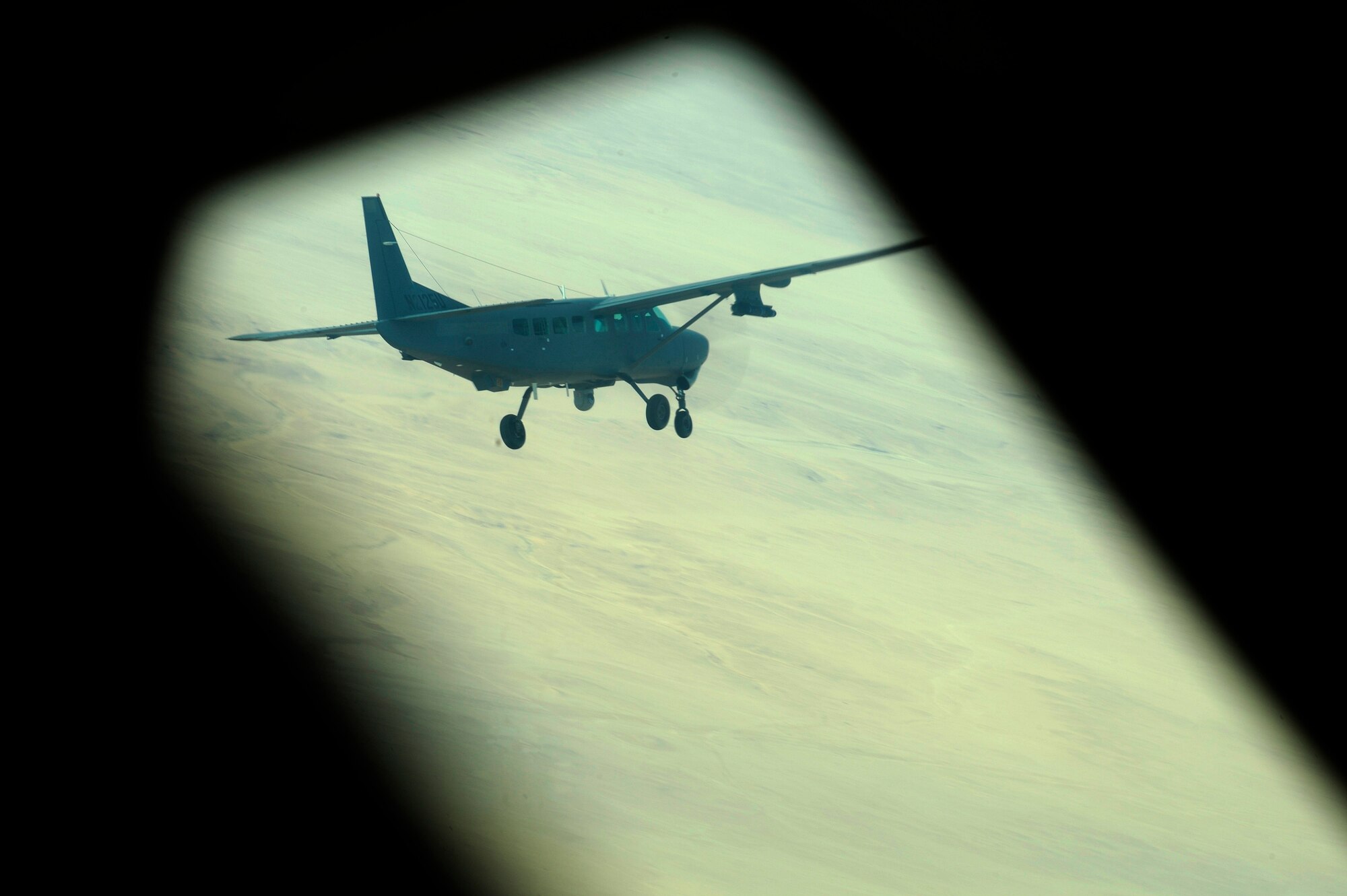 An Iraqi Air Force AC-208 from Squadron 3 at Kirkuk Air Base, Iraq, flies a training mission, Oct. 21, 2009. (U.S. Air Force photo/Staff Sgt. Michael B. Keller) 

