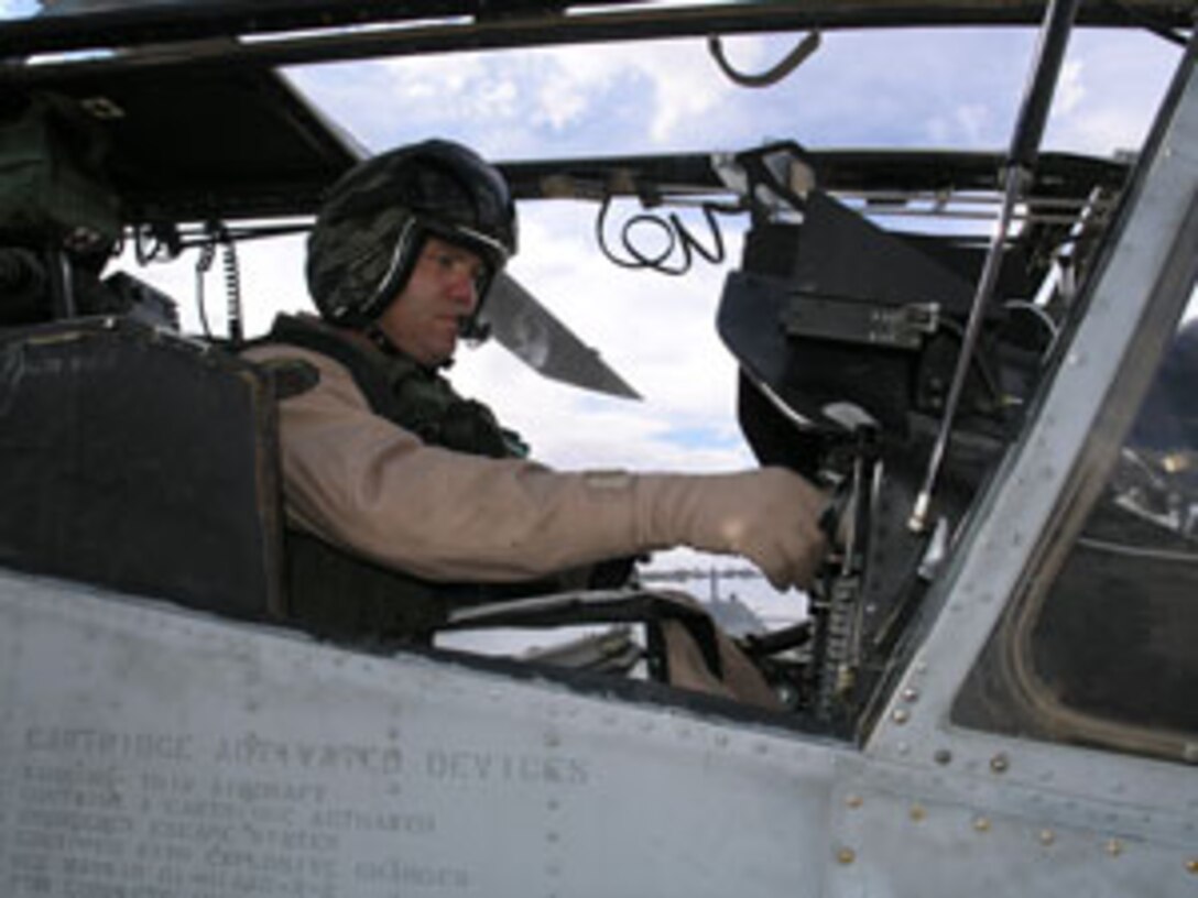 Major Owen Coulman prepares an AH-1W Super Cobra for takeoff.  Marines of Marine Light Attack Helicopter Squadron 267, Marine Aircraft Group 39, 3rd Marine Aircraft Wing, assisted the U.S. Border Patrol in operations along the U.S.-Mexico border, aiding in drug and human smuggling interdiction.