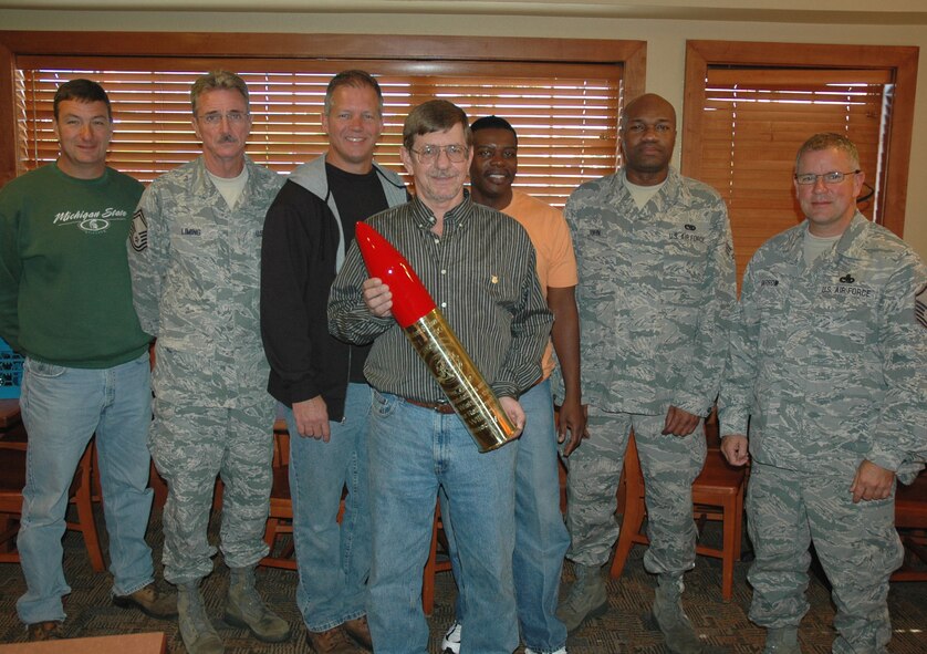 Mr. Shaud poses with fellow Duke Field maintainers following an informal retirement sendoff luncheon held in his honor Nov. 20. (U.S. Air Force photo/Staff Sgt. Jon McCallum)
