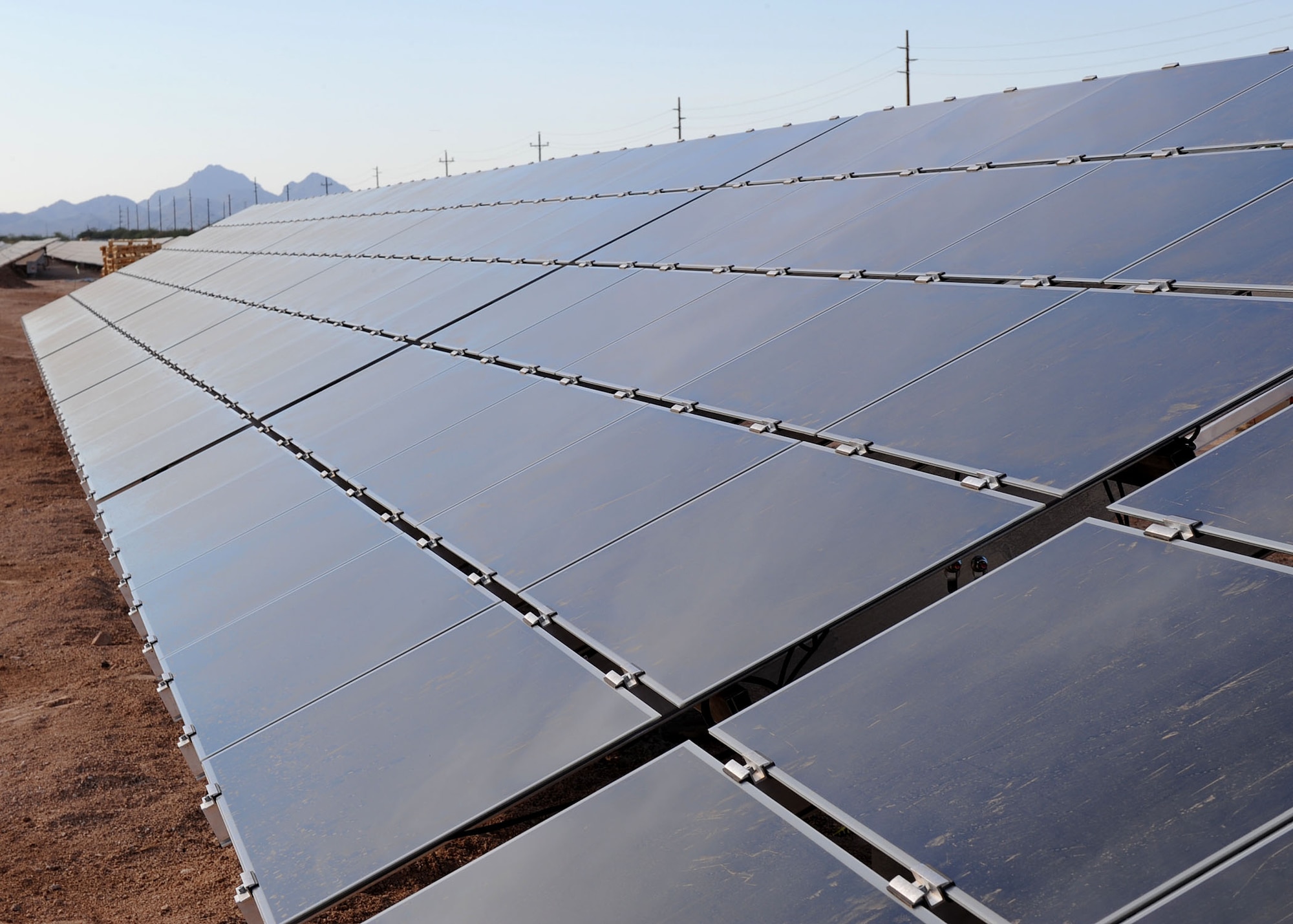 During a ceremony hosted by Soaring Heights Communities Nov. 10, more than 80,000 solar array panels were showcased. During installation, a 45,000 panel ground-mounted photovoltaic (PV) system and rooftop solar system will be installed at Davis-Monthan on approximately 900 residences. The rooftop solar system is expected to consist of more than 36,000 panels. The ground-mounted array is expected to be complete by January with the rooftop systems installed on hundreds of new and existing homes by the end of 2010. Once complete, this will be the largest solar-powered community -- not just in Arizona, but the continental U.S. This will also be one of the few solar-powered communities on a state-side Air Force Base. (U.S. Air Force photo by/Staff Sgt. Jacqueline Romero)

