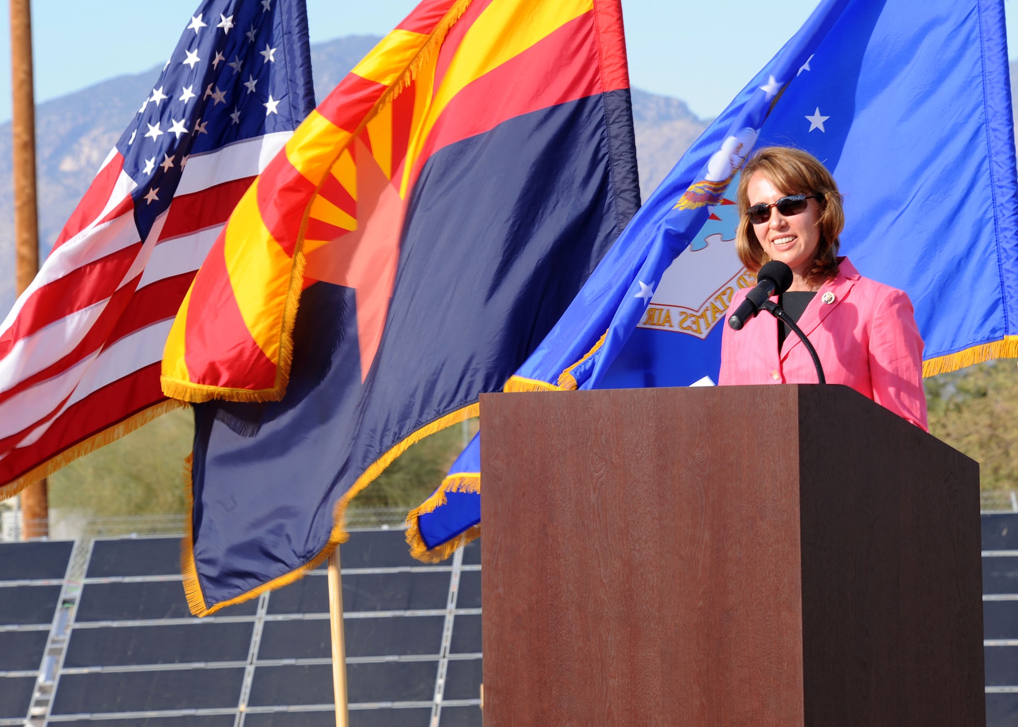 Arizona Congresswoman Gabrielle Giffords addresses the crowd during a ceremony hosted by Soaring Heights Communities Nov. 10. Congresswoman Giffords was here to celebrate what will become the largest solar-powered community in the continental U.S. The event showcased the on-going construction of more than 80,000 solar array panels in the base's privatized housing neighborhood. Several private companies are working to create one of the nation's largest distributed, community-wide solar power systems at Davis-Monthan. This system is expected to produce more than 10 million
kilowatt hours of electricity annually. This is sufficient enough to provide an estimated 75 percent of the residents' energy use next year and could eventually offset more than 100 percent of Soaring Heights Communities' electricity use. (U.S. Air Force photo by/Staff Sgt. Jacqueline Romero)

