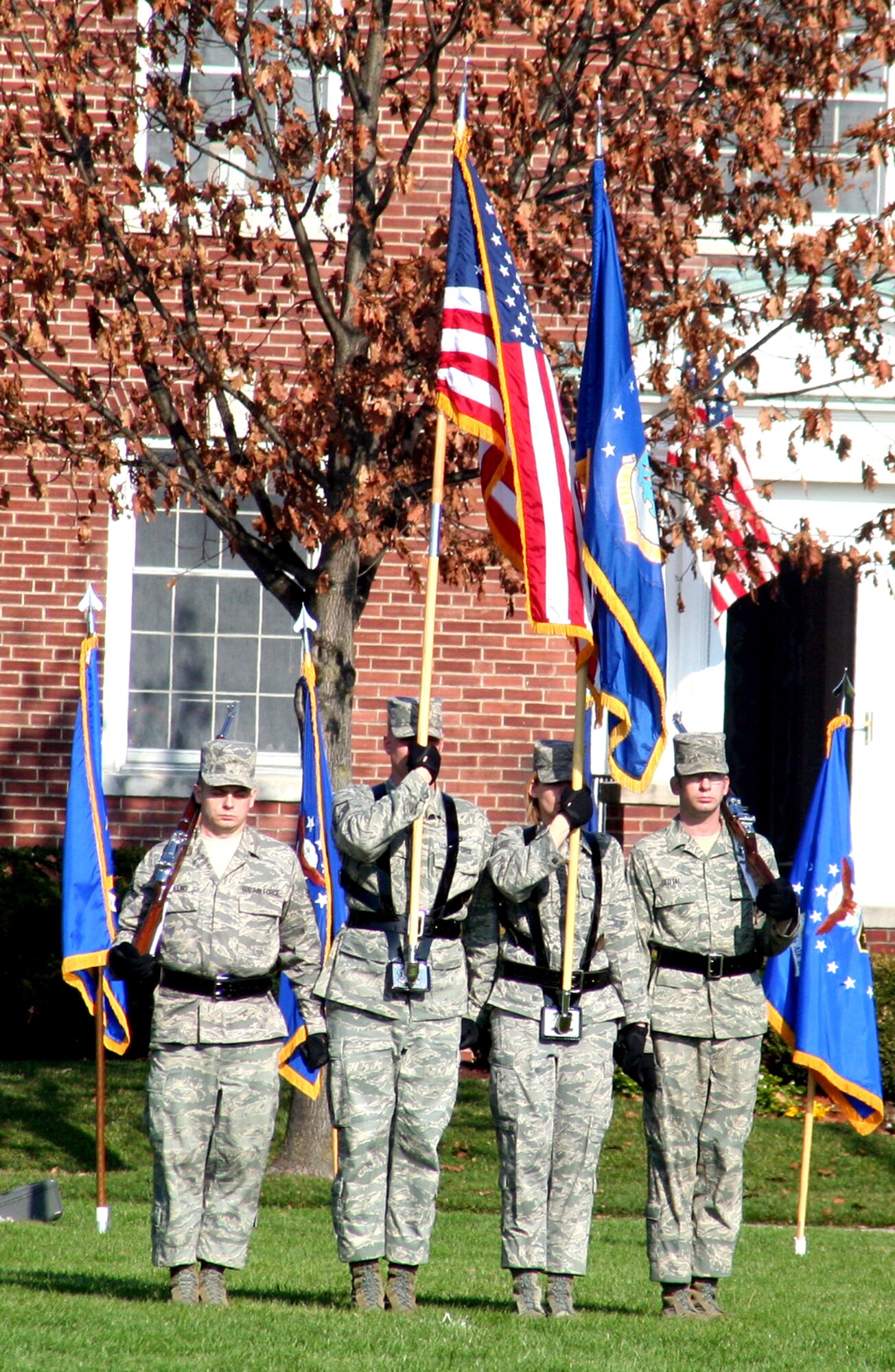 Airmen assigned to the color guard participate in the Air Mobility Command change of command ceremony on Nov. 20, 2009, at Scott Air Force Base, Ill.  During the ceremony, Gen. Raymond E. Johns took command of AMC. (U.S. Air Force Photo/Tech. Sgt. Scott T. Sturkol)