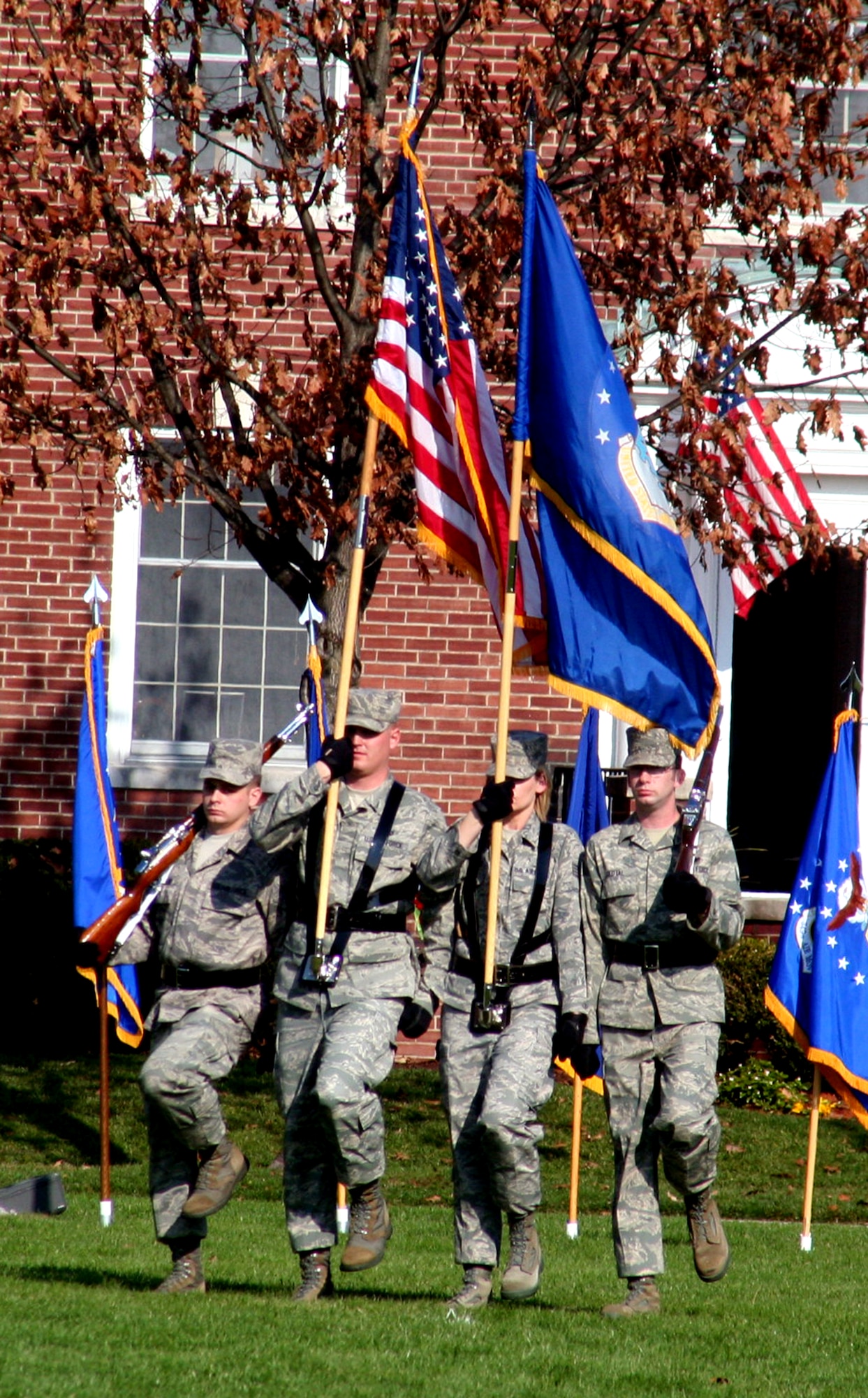 Airmen assigned to the color guard participate in the Air Mobility Command change of command ceremony on Nov. 20, 2009, at Scott Air Force Base, Ill.  During the ceremony, Gen. Raymond E. Johns took command of AMC. (U.S. Air Force Photo/Tech. Sgt. Scott T. Sturkol)