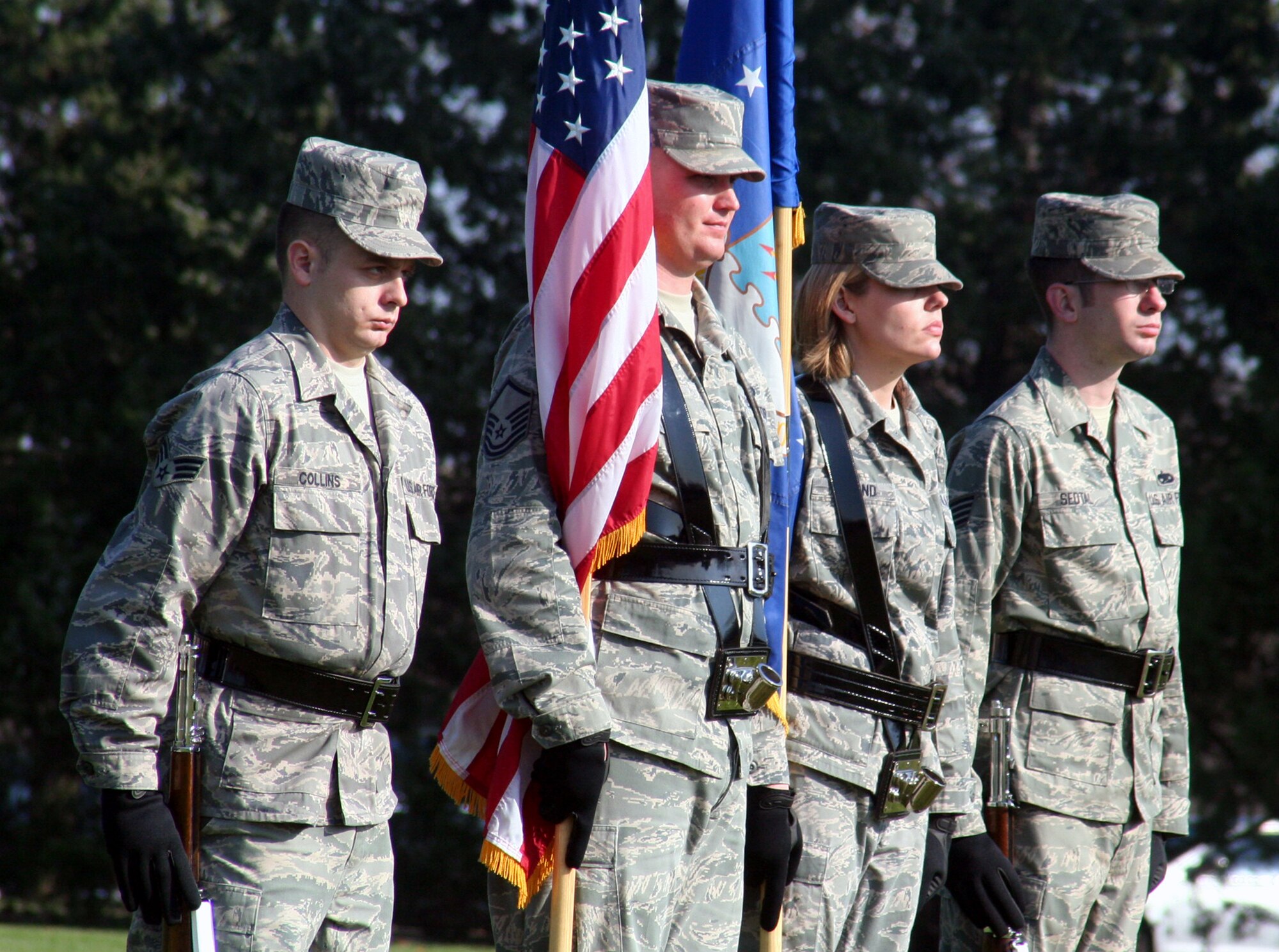 Airmen assigned to the color guard participate in the Air Mobility Command change of command ceremony on Nov. 20, 2009, at Scott Air Force Base, Ill.  During the ceremony, Gen. Raymond E. Johns took command of AMC. (U.S. Air Force Photo/Tech. Sgt. Scott T. Sturkol)