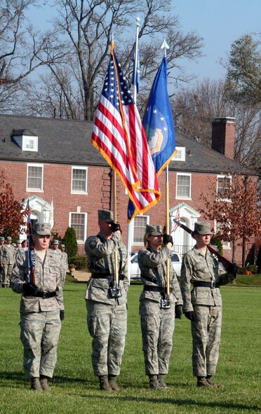 Airmen assigned to the color guard stand ready during the Air Mobility Command change of command ceremony on Nov. 20, 2009, at Scott Air Force Base, Ill.  During the ceremony, Gen. Raymond E. Johns Jr. took command of AMC. (U.S. Air Force Photo/Tech. Sgt. Scott T. Sturkol)