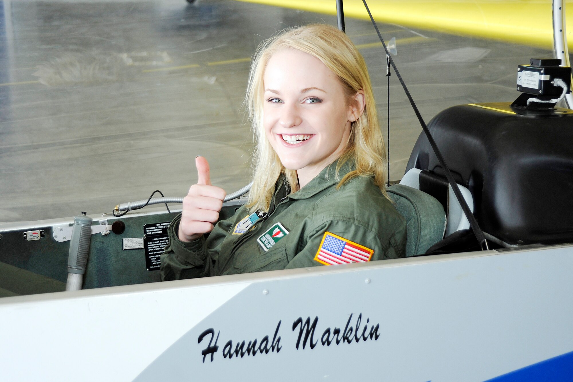 Hannah Marklin of Parker, Colo., sits in a U.S. Air Force Academy glider emblazoned with her name Nov. 13, 2009.  She was visiting the Academy as "Cadet for a Day."  The program is a collaboration with the Colorado Make-a-Wish Foundation to provide young people facing severe medical challenges the opportunity to experience life as a cadet.  Hanna's visit was hosted by Cadet Squadron 31.  Academy cadets have hosted 32 youths since the program's inception. (U.S. Air Force photo/Bill Evans)