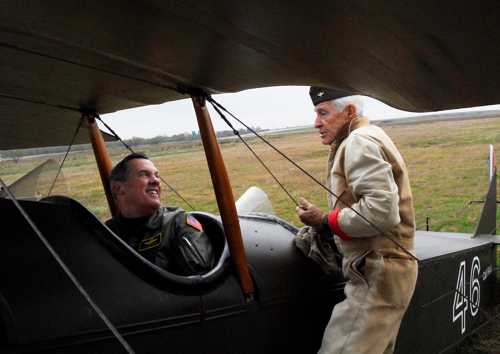 World War II and Korean War veteran Tom Danaher talks with Brig. Gen. O.G. Mannon, 82nd Training Wing commander, prior to their flight in a 90-year-old Curtiss JN-4D "Jenny" Nov. 21 at Kickapoo Airport in Wichita Falls, Texas. The general was invited by Mr. Danaher, a pilot with more than 23,000 flying hours, to tour the Call Field Museum and go for a ride in the vintage aircraft owned by the City of Wichita Falls. (U.S. Air Force photo/Harry Tonemah)