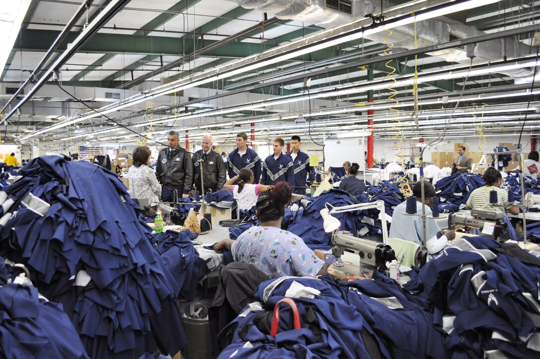 Cathy Griffith explains how the new Air Force physical fitness outer garment is made Nov. 3, 2009, at the facility in Columbus, Miss. Ms. Griffith is the American Power Source operations manager. (U.S. Air Force photo/Sonic Johnson)