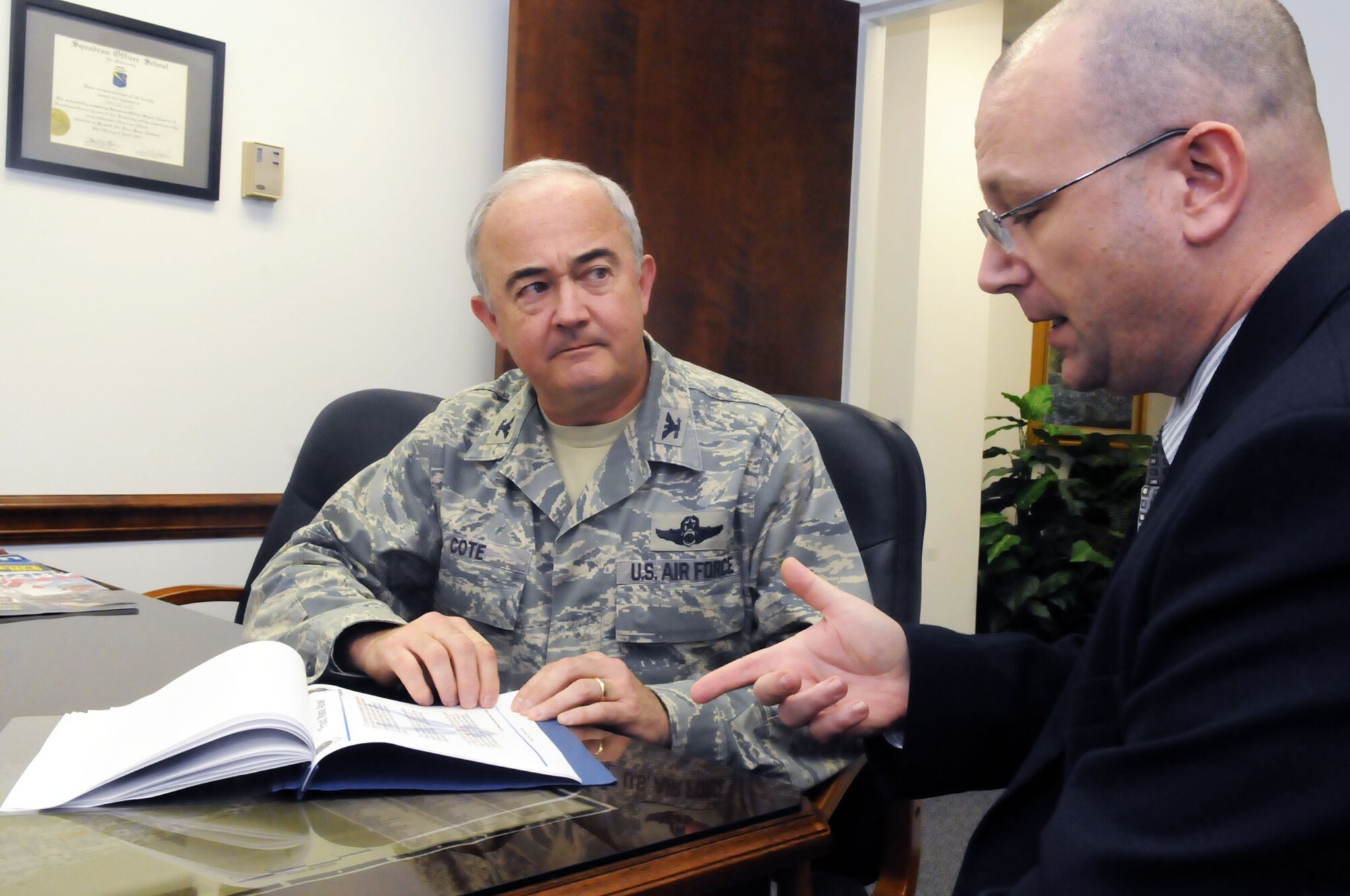 Col. John Cote, 78th ABW Inspector General and Tony Congi, Deputy IG, go over a training presentation looking for ways to hone and improve upon it. U. S. Air Force photo by Sue Sapp