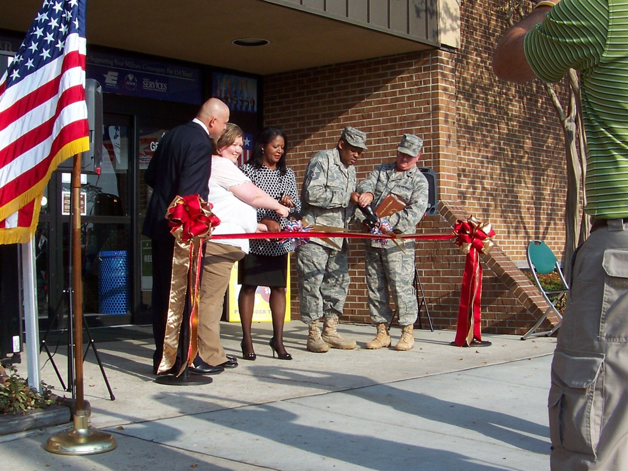 MOODY AIR FORCE BASE, Ga. -- (Left to right) Chris Holifield, Army & Air Force Exchange Service general manager, Debra O'Brien, Moody’s Main Exchange manager, LaSharnda Beckwith, AAFES Eastern Region vice president, Chief Master Sgt. Kenneth Lilly, 23rd Wing weapons manager, and Lt Col. Thomas Angelo, 23rd Wing chaplain, cut the official ribbon during the AAFES Main Exchange grand re-opening ceremony here Nov. 18. (Courtesy photo)