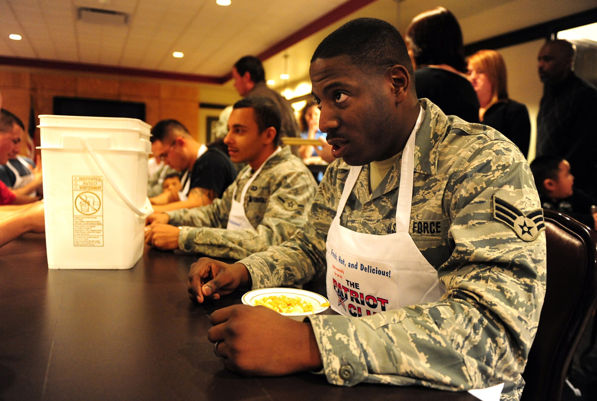 OFFUTT AIR FORCE BASE, Neb. - Senior Airman Reshoun Coverson, 55th Operations Support Squadron, prepares himself for the second dish on the Fear Factor challenge, ostrich eggs and cow brains, at the Patriot Club Nov. 20.  Participants, with precautionary buckets nearby, downed four stomach-turning dishes for the chance to win cash prizes.

U.S. Air Force photo by Josh Plueger
