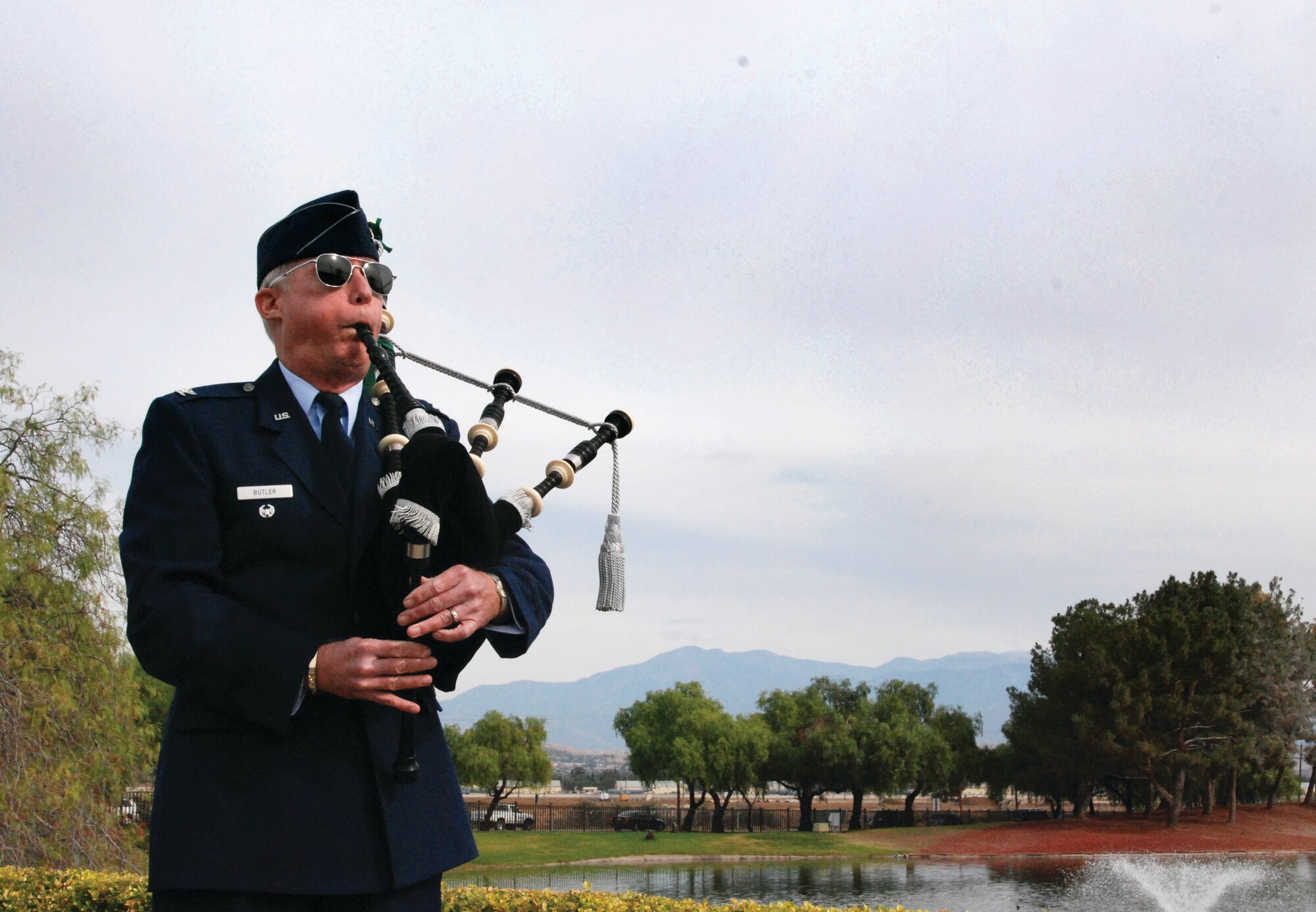 Col. Raymond Butler (ret.), former 452 AMW Medical Group commander, played bagpipes at the service. (U.S. Air Force photos by Megan Just)