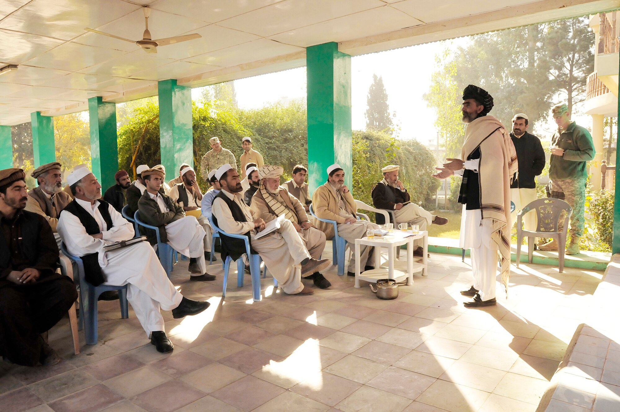 Local leaders, engineers, construction contractors and foremen listen as Hamid Shah speaks during a monthly contractor training session held at the Civil Military Operations Center in Khost province, Afghanistan, Nov. 14, 2009. Engineers from the Khost Provincial Reconstruction Team provided construction quality assurance training to locals in order to facilitate high quality construction practices in the region. Mr. Shah is the director of economics for Khost province. (U.S. Air Force photo/Staff Sgt. Stephen J. Otero)