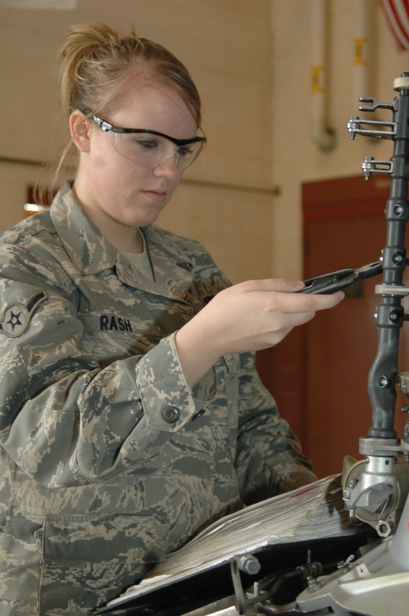 Airman Ashton Rash, a jet engine mechanic from the 917th Maintenance Squadron on Barksdale Air Force Base, La., performs routine maintenance on an engine during her unit training assembly weekend (UTA) November 8, 2009. Airman Rash, who is originally from Lufkin, Texas, has been in the Air Force for a year and a half. Airman Rash says that her favorite thing about working in the 917th MXS is the people that she has had the opportunity to meet and work alongside with. (U.S. Air Force photo/Airman 1st Class Crystal Jordan)