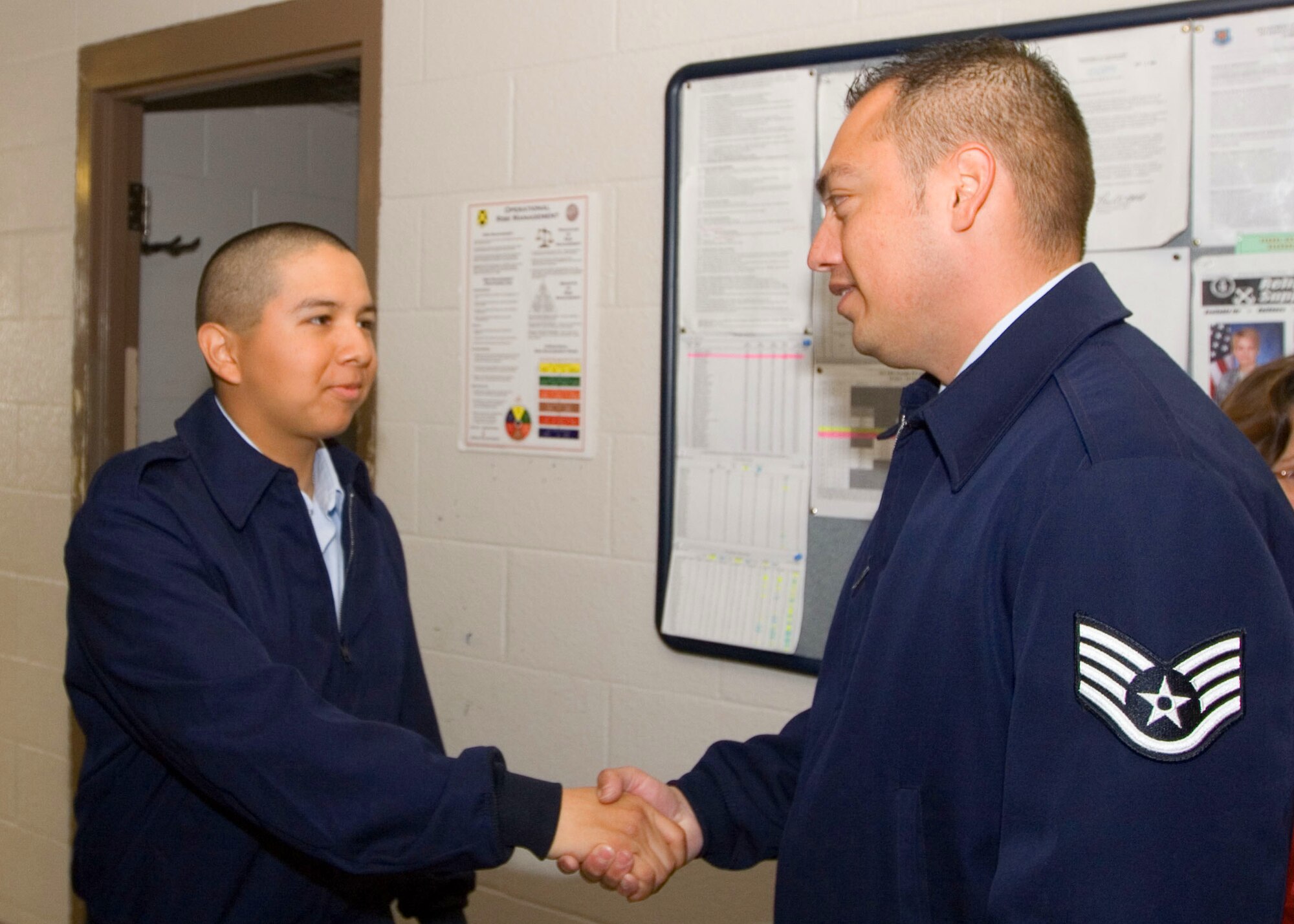 LACKLAND AIR FORCE BASE, Texas -- Staff Sgt. Eduardo Velarde, 341st Recruiting Squadron, speaks with a basic trainee who was one of his recruits. (U.S. Air force photo/Master Sgt. Thomas)