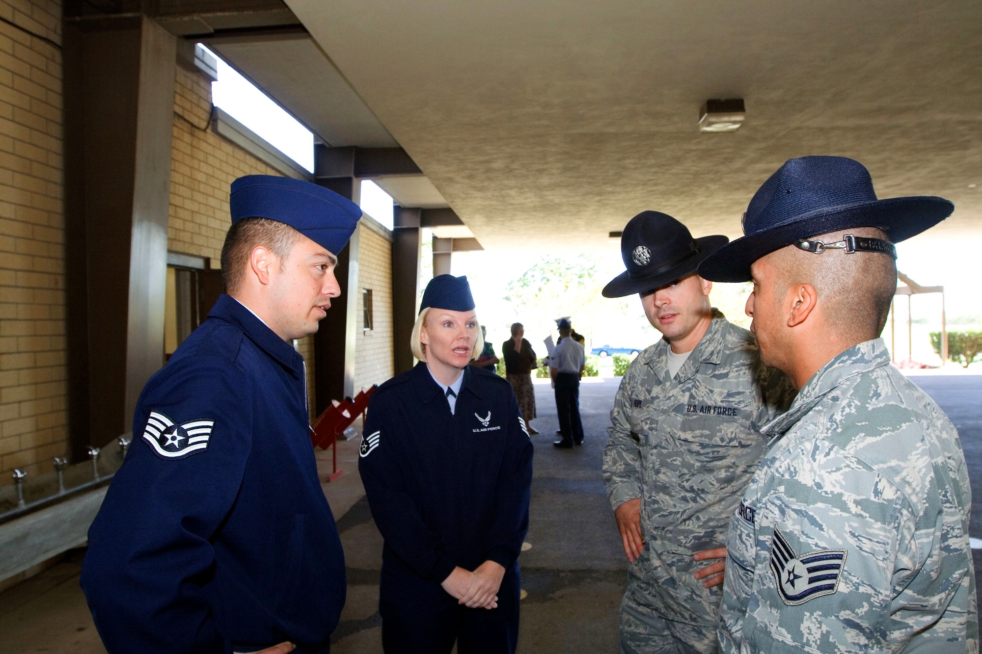 LACKLAND AIR FORCE BASE, Texas -- Staff Sgts. Eduardo Velarde, 341st Recruiting Squadron; Cheryl Vercellona, 341st Recruiting Squadron; Jesse Hope, 323rd
Training Squadron and Joseph Flores, 323rd Training Squadron discuss training techniques between basic military training events. (U.S. Air force photo/Master Sgt. Thomas)