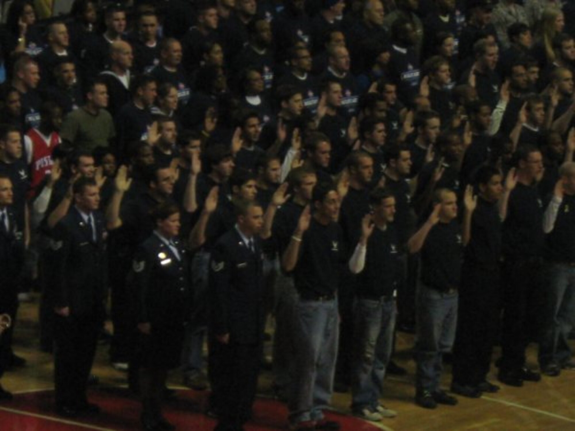 A mass enlistment if 141 new Air Force recruits in the delayed enlistment program during the Military Appreciation Night at a Detroit Pistons game in Michigan. The mass enlistment was shown live on national and local television. (U.S.Air Force photo/Sylvia Mulshine)