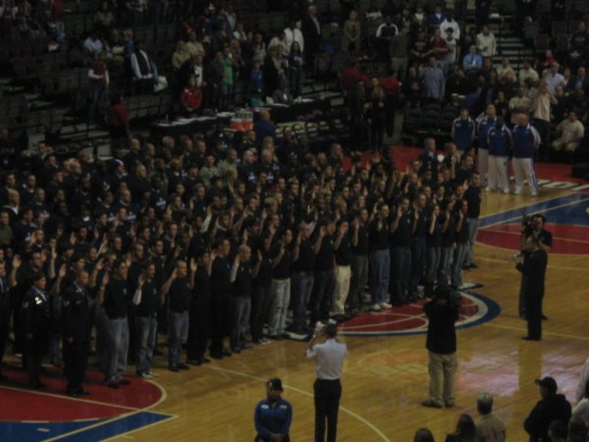 A mass enlistment if 141 new Air Force recruits in the delayed enlistment program during the Military Appreciation Night at a Detroit Pistons game in Michigan. The mass enlistment was shown live on national and local television. (U.S.Air Force photo/Sylvia Mulshine)