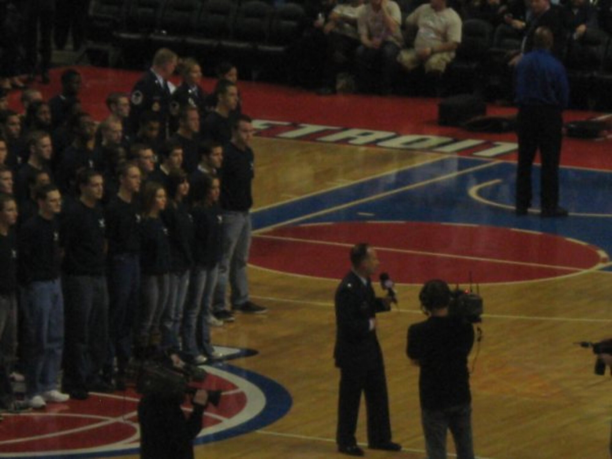 A mass enlistment if 141 new Air Force recruits in the delayed enlistment program during the Military Appreciation Night at a Detroit Pistons game in Michigan. The mass enlistment was shown live on national and local television. (U.S.Air Force photo/Sylvia Mulshine)