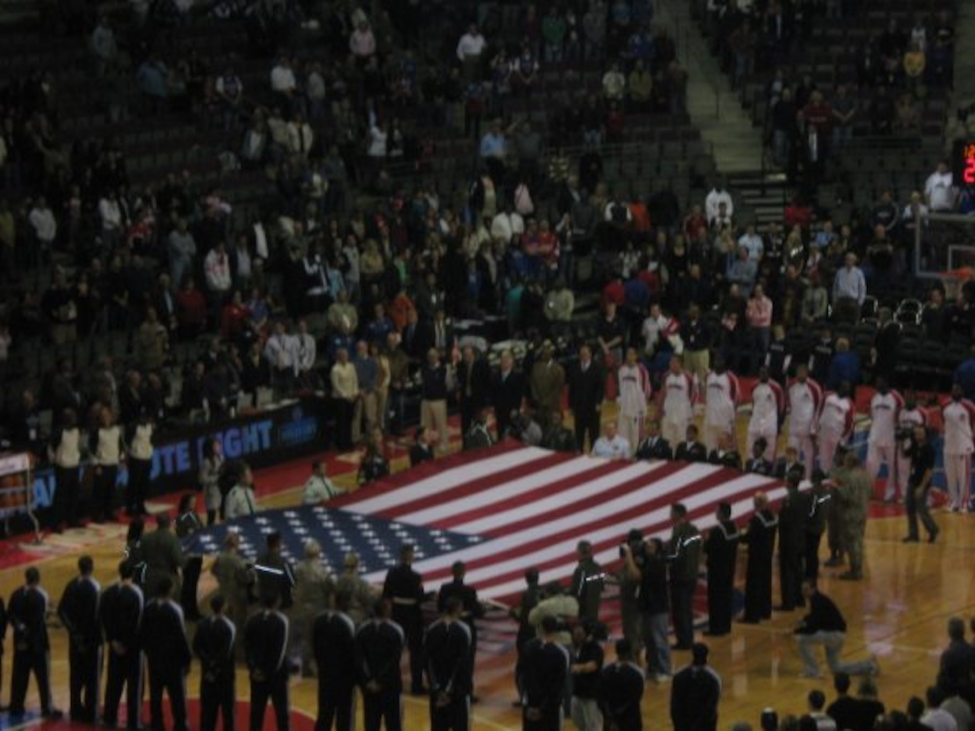 A mass enlistment if 141 new Air Force recruits in the delayed enlistment program during the Military Appreciation Night at a Detroit Pistons game in Michigan. The mass enlistment was shown live on national and local television. (U.S.Air Force photo/Sylvia Mulshine)