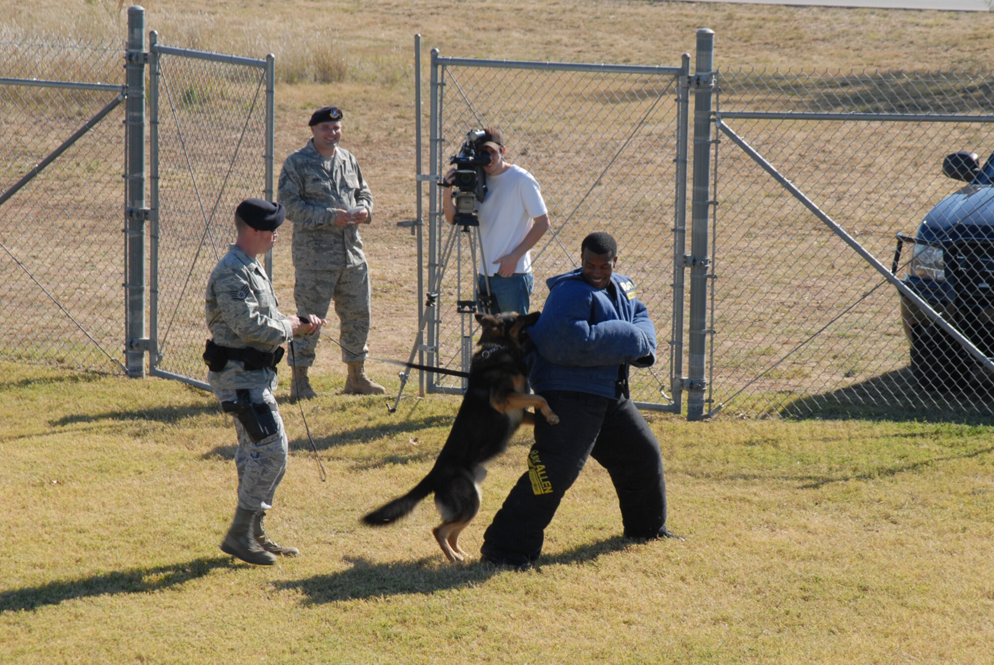 GOODFELLOW AIR FORCE BASE, Texas -- Spidla, 17th Security Forces Squadron military working dog, attacks Senior Airman Vernon Boyd, 17th SFS, during a demonstration for Community Appreciation Day, Nov. 21, 2009. Other events during the day included firefighting exercises, a live demonstration of military operations in urban terrain, and a bus tour of the base. (U.S. Air Force photo/Staff Sgt. Laura R. McFarlane)
