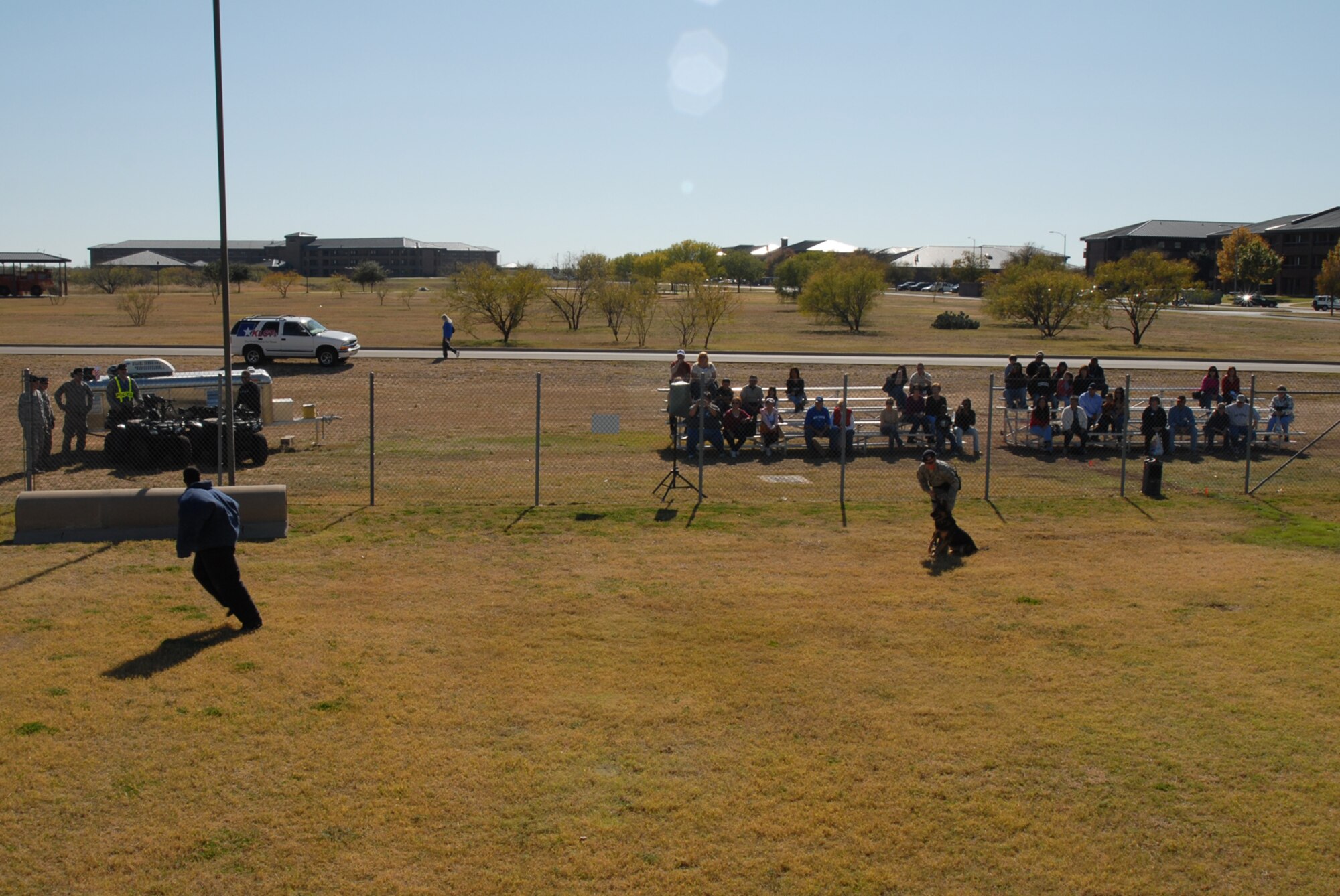 GOODFELLOW AIR FORCE, Texas -- Members of the San Angelo community watch a military working dog demonstration during Community Appreciation Day, Nov. 21, 2009. Other events during the day included firefighting exercises, a live demonstration of military operations in urban terrain, and a bus tour of the base. (U.S. Air Force photo/Staff Sgt. Laura R. McFarlane)

