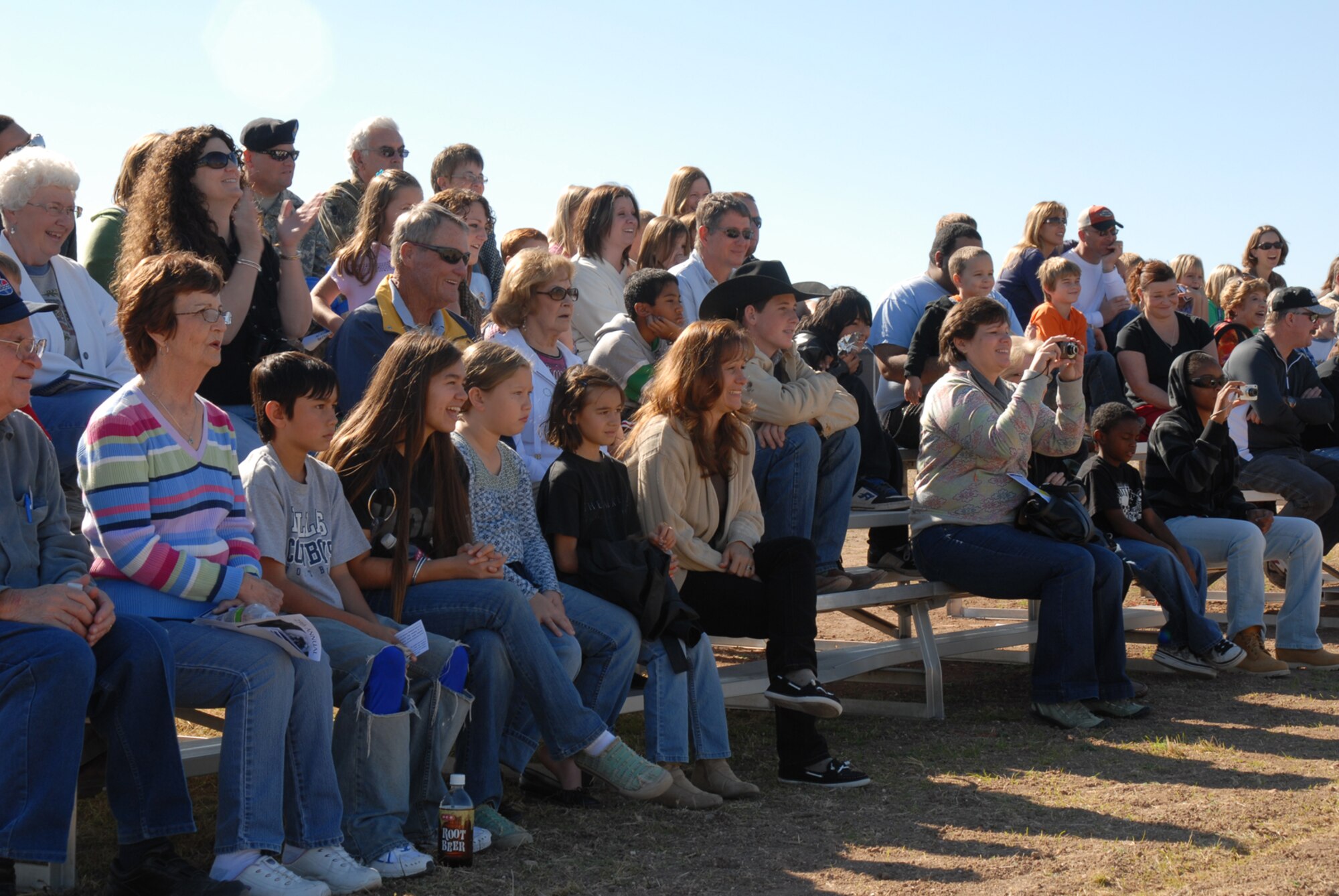 GOODFELLOW AIR FORCE, Texas -- Members of the San Angelo community watch a military working dog demonstration during Community Appreciation Day, Nov. 21, 2009. Other events during the day included, firefighting exercises, a live demonstration of military operations in urban terrain, and a bus tour of the base. (U.S. Air Force photo/Staff Sgt. Laura R. McFarlane)
