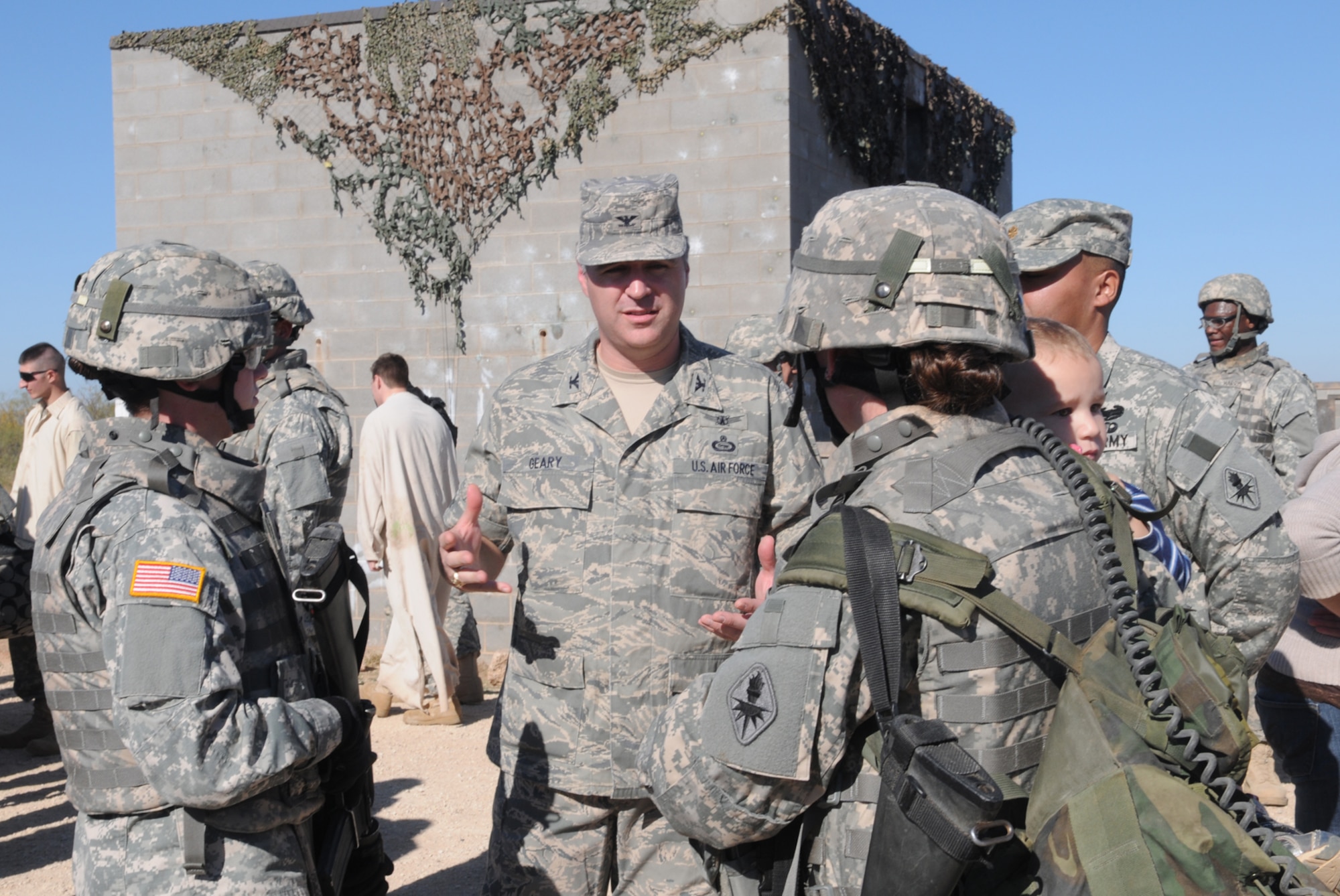 GOODFELLOW AIR FORCE BASE, Texas -- Col. Thomas Geary, 17th Training Wing commander, speaks with soldiers from the 344th Military Intelligence Battalion following a military operations in urban terrain demonstration during Community Appreciation Day, Nov. 21, 2009. Other events during the day included military working dog demonstrations, firefighting exercises, a Marine Corps Martial Arts Program demonstration, and a bus tour of the base. (U.S. Air Force photo/Airman Clayton Lenhardt)
