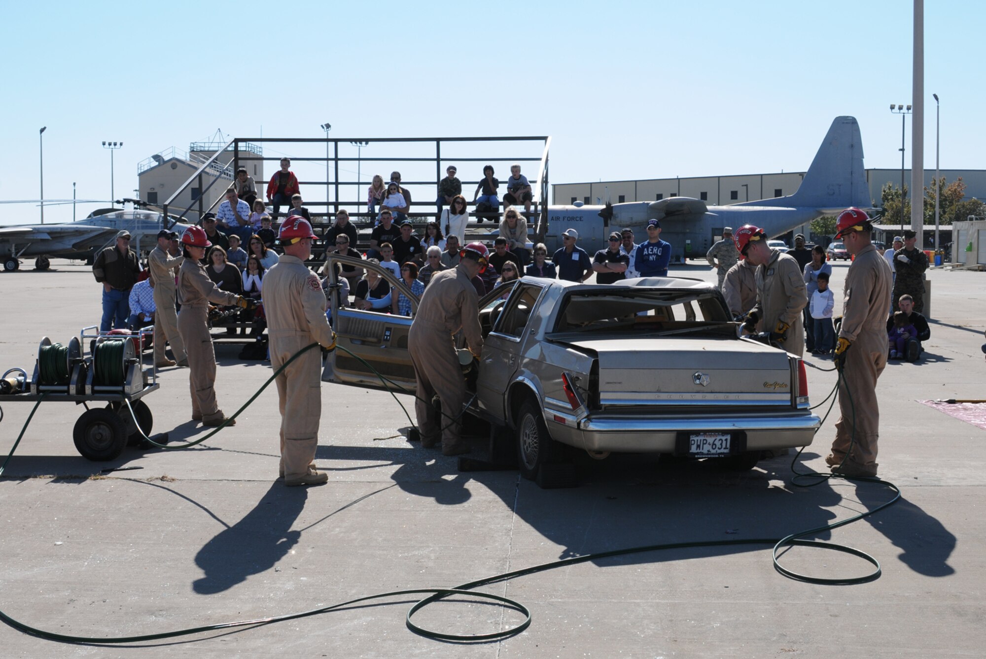 GOODFELLOW AIR FORCE BASE, Texas -- Instructors from the 312th Training Squadron demonstrate vehicle extrication for members of the San Angelo community, Nov. 21, 2009, during Community Appreciation Day. Other events during the day included military working dog demonstrations, firefighting exercises, a live demonstration of military operations in urban terrain, and a bus tour of the base. (U.S. Air Force photo/Airman Clayton Lenhardt)
