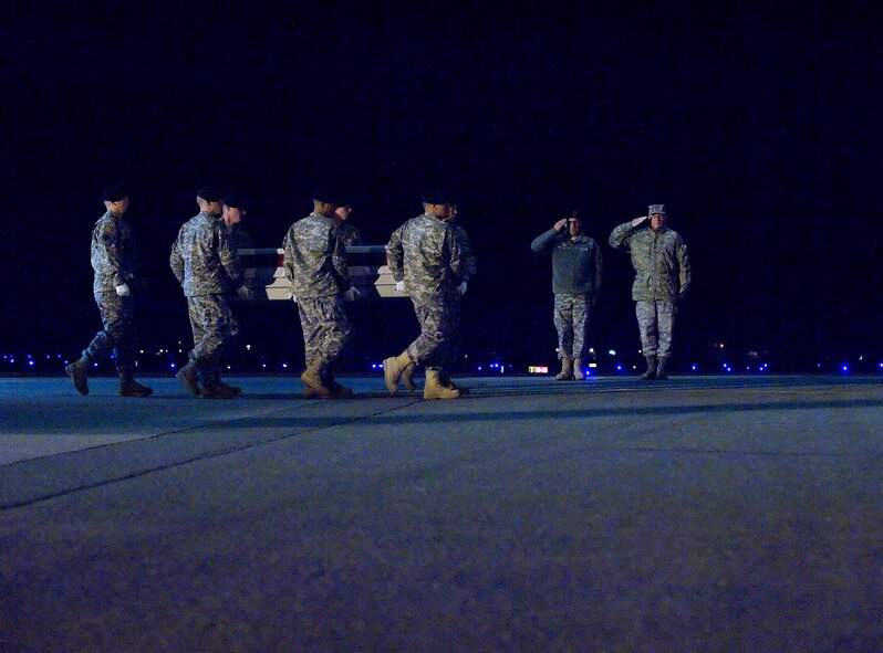 A U.S. Army carry team transfers the remains of Army Specialist Daniel A. Frazier., of Saint Joseph, Mich., at Dover Air Force Base, Del., Nov. 21, 2009. Specialist Frazier was assigned to Company E, 782nd Brigade Support Bat, Fort Bragg, NC. (U.S. Air Force photo by Brianne Zimny)