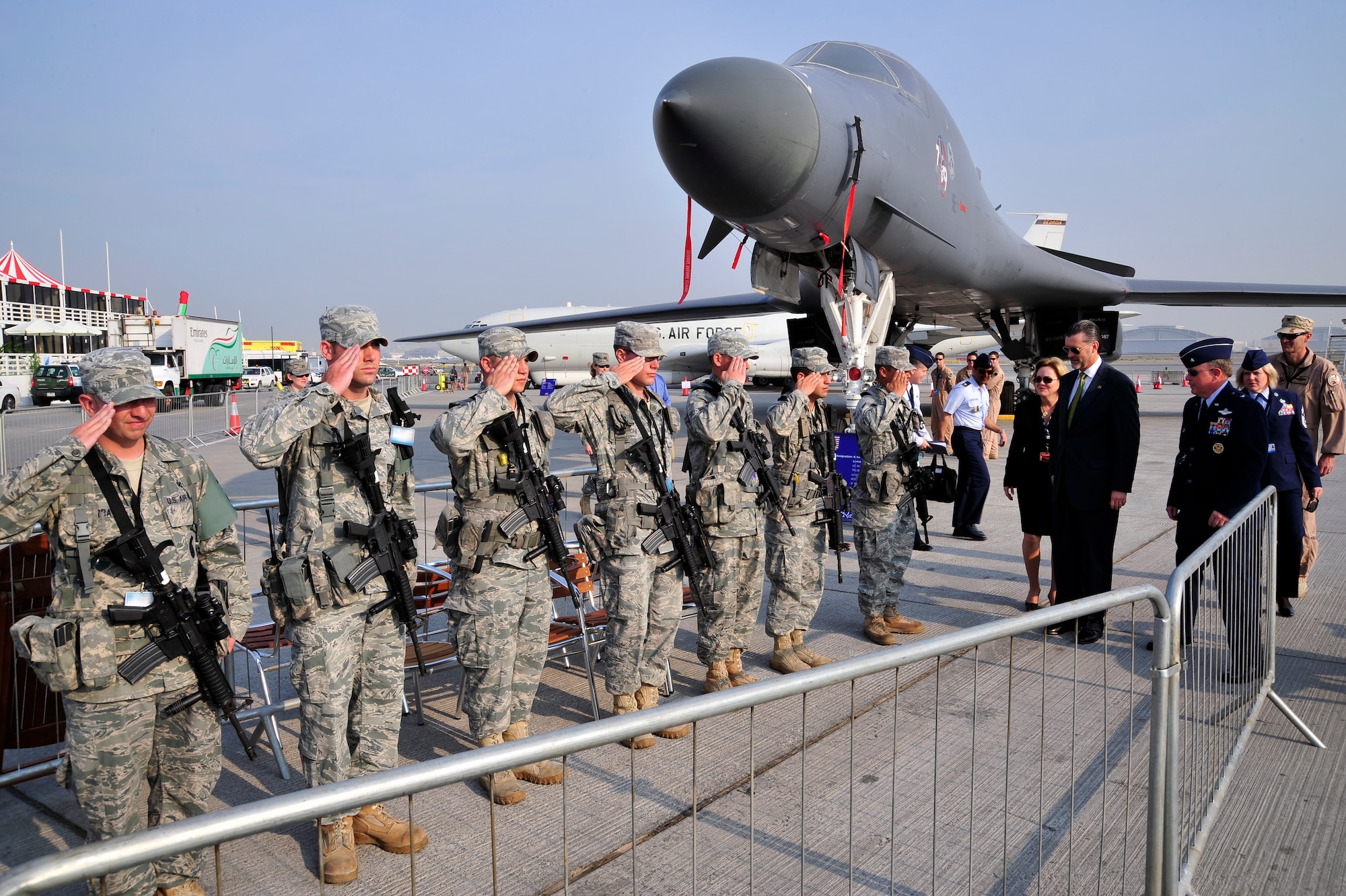 DUBAI, United Arab Emirates - Deborah Jones, U.S. Ambassador to Kuwait, Richard Olsen, U.S. Ambassador to the United Arab Emirates and Brig. Gen. Bryan Benson, 380th Air Expeditionary Wing commander, exit the Department of Defense static displays at the Dubai Air Show Nov. 15, 2009. Ambassador Jones, Ambassador Olsen and General Benson were saluted by the security forces defenders prior to leaving the area. (U.S. Air Force photo/Tech. Sgt. Charles Larkin Sr)