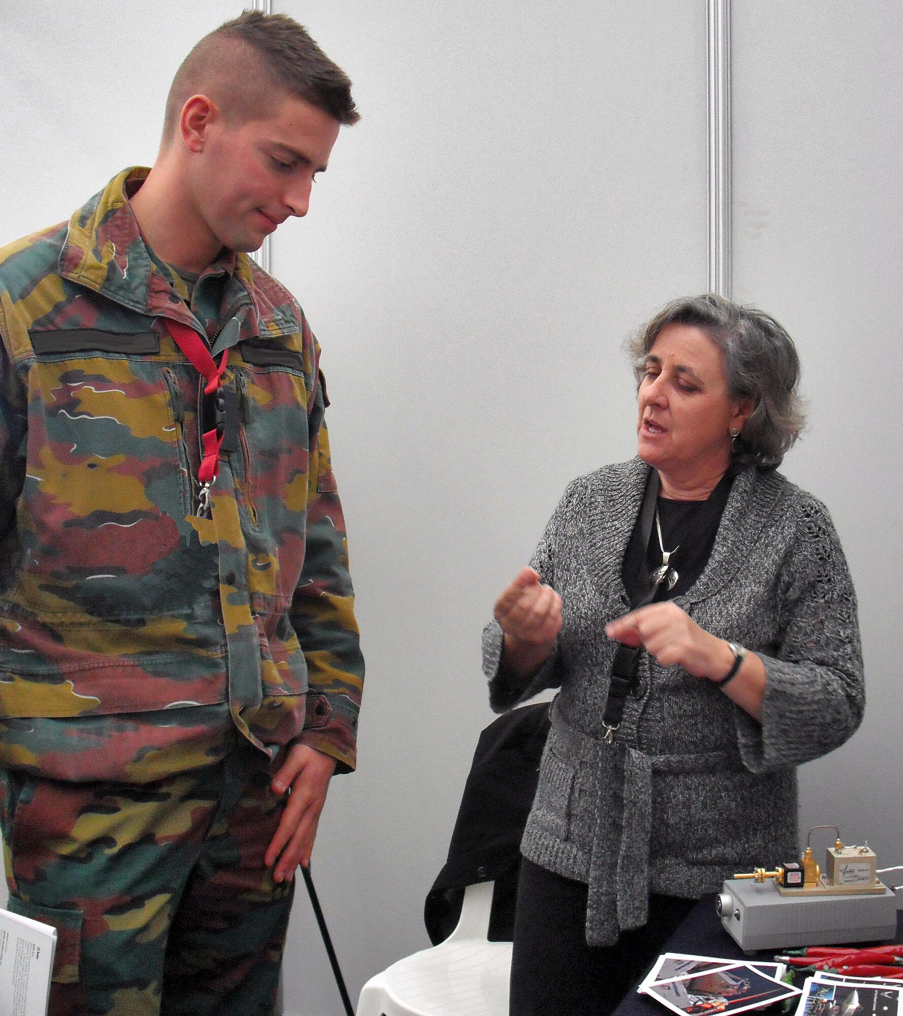 At the Belcoast 2009 demonstration and exercise held at Koksijde Air Base, Belgium, in October, Dr. Sylvia Dorato of the Directed Energy Directorate explains the benefits of the active denial technology to an officer from the Belgian Defence Force. Active denial technology delivers millimeter wave energy to repel an adversary without permanent injury. This breakthrough technology is expected to save lives by providing a means to stop individuals without resorting to deadly force. U.S. Air Force Photo by Jan Bush 