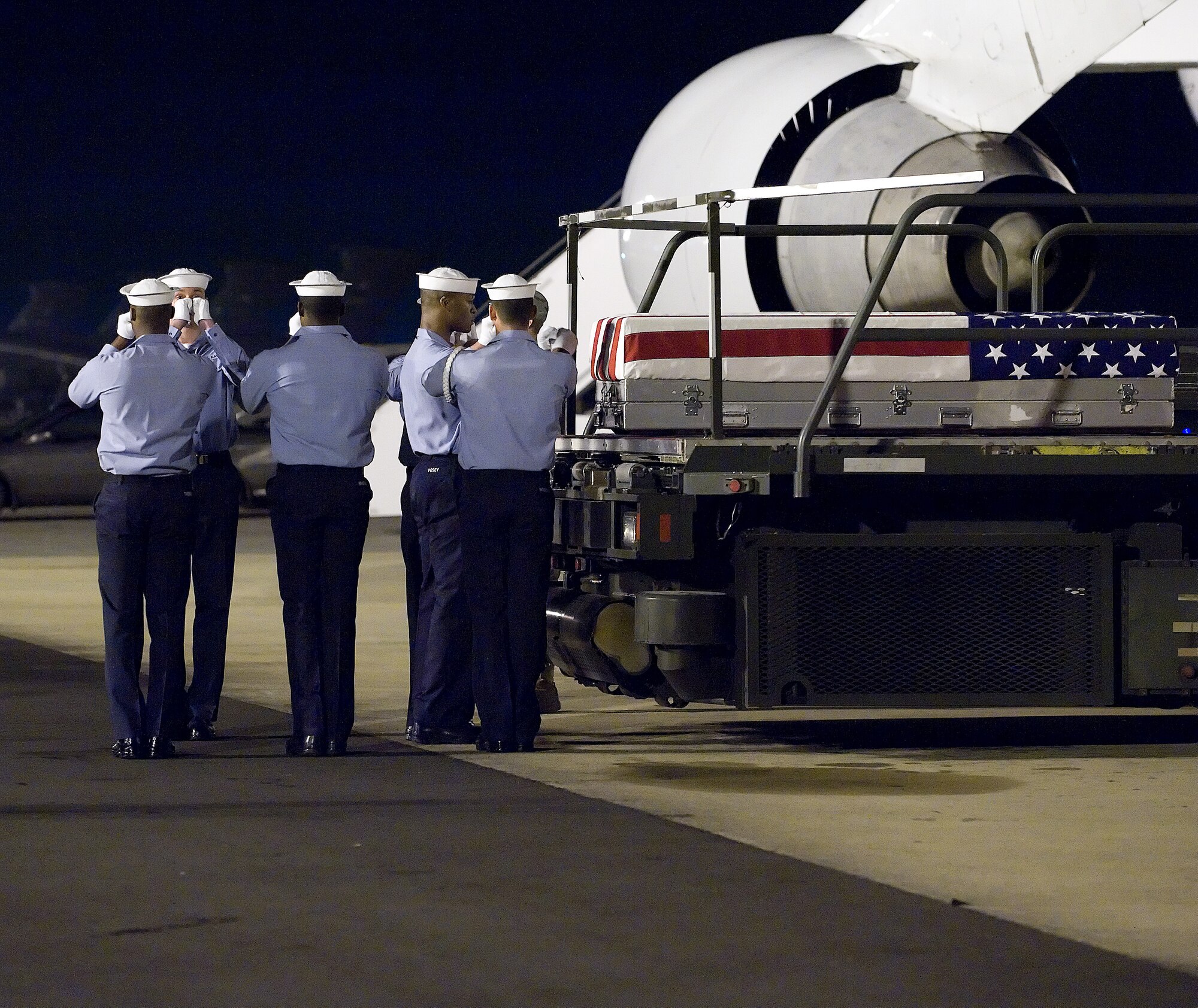A U.S. Navy carry team transfers the remains of Petty Officer 2nd Class Brian M. Patton, of Nanticoke, Pa., at Dover Air Force Base, Del. on Nov. 20, 2009. Petty Officer Patton died Nov. 19 in Kuwait in a non-combat accident.  