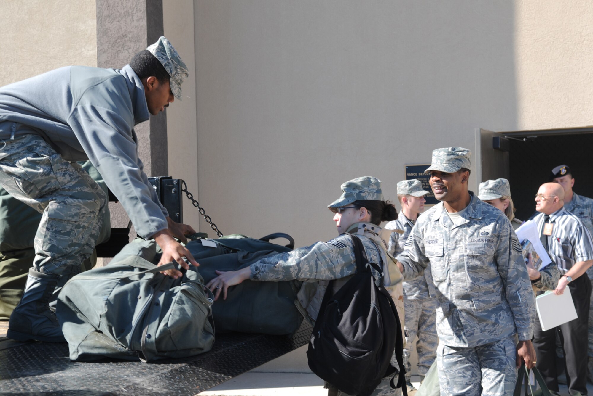GOODFELLOW AIR FORCE BASE, Texas -- Senior Airman Rashad Aldridge, 17th Communications Squadron, loads mobility bags onto the back of a truck during a deployment exercise, Nov. 18, 2009. Deployment exercises test Goodfellow's ability to deploy in response to real world situations. (U.S. Air Force photo/Airman 1st Class Clayton Lenhardt)
