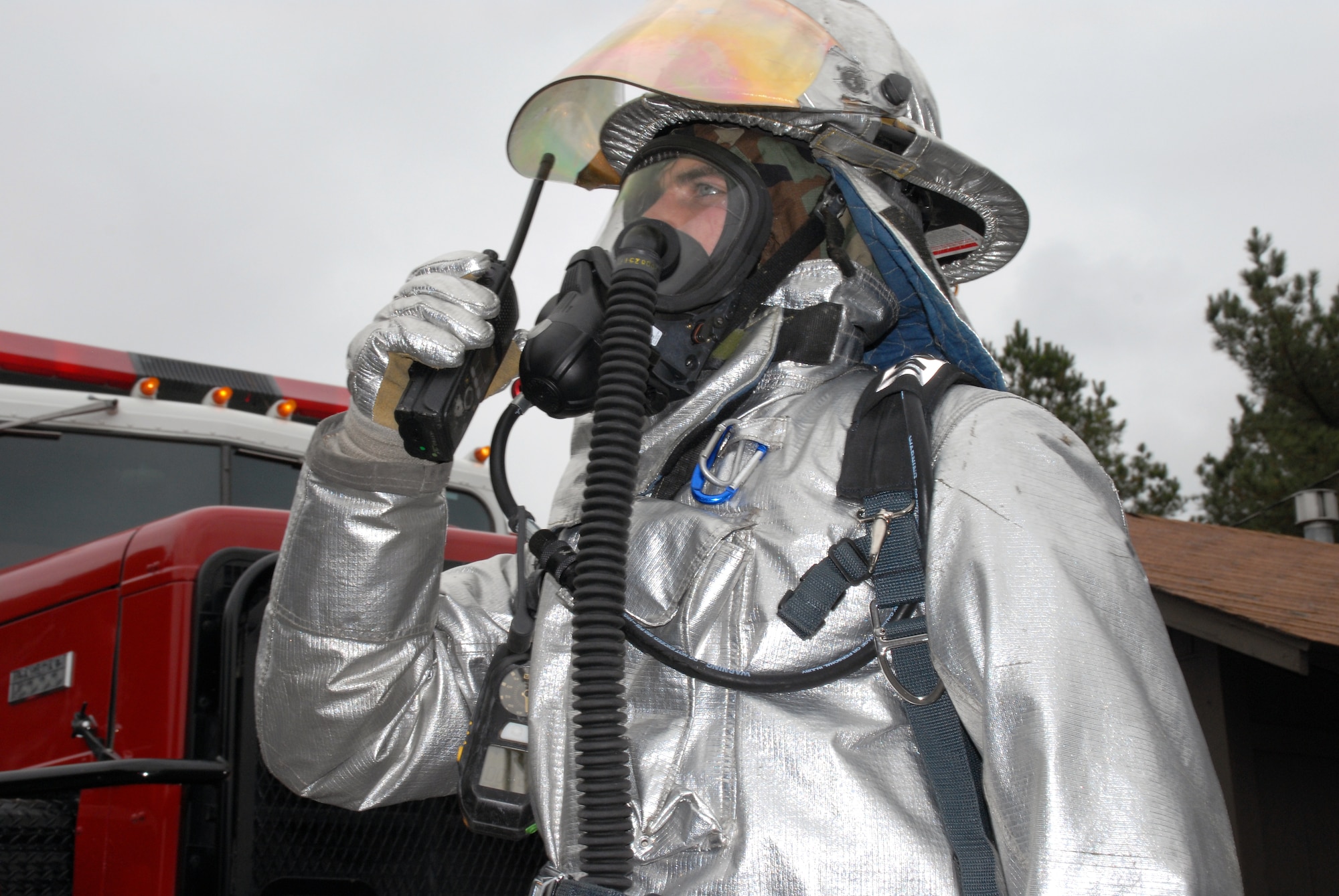 Senior Airman Jacob Schmidt, 19th Civil Engineering Squadron firefighter, reports incident details to leaders during fire fighters response to a building that was attacked by a simulated missile during the base’s exercise Nov. 17. (U.S. Air Force photo by Senior Airman Michael Watkins)
