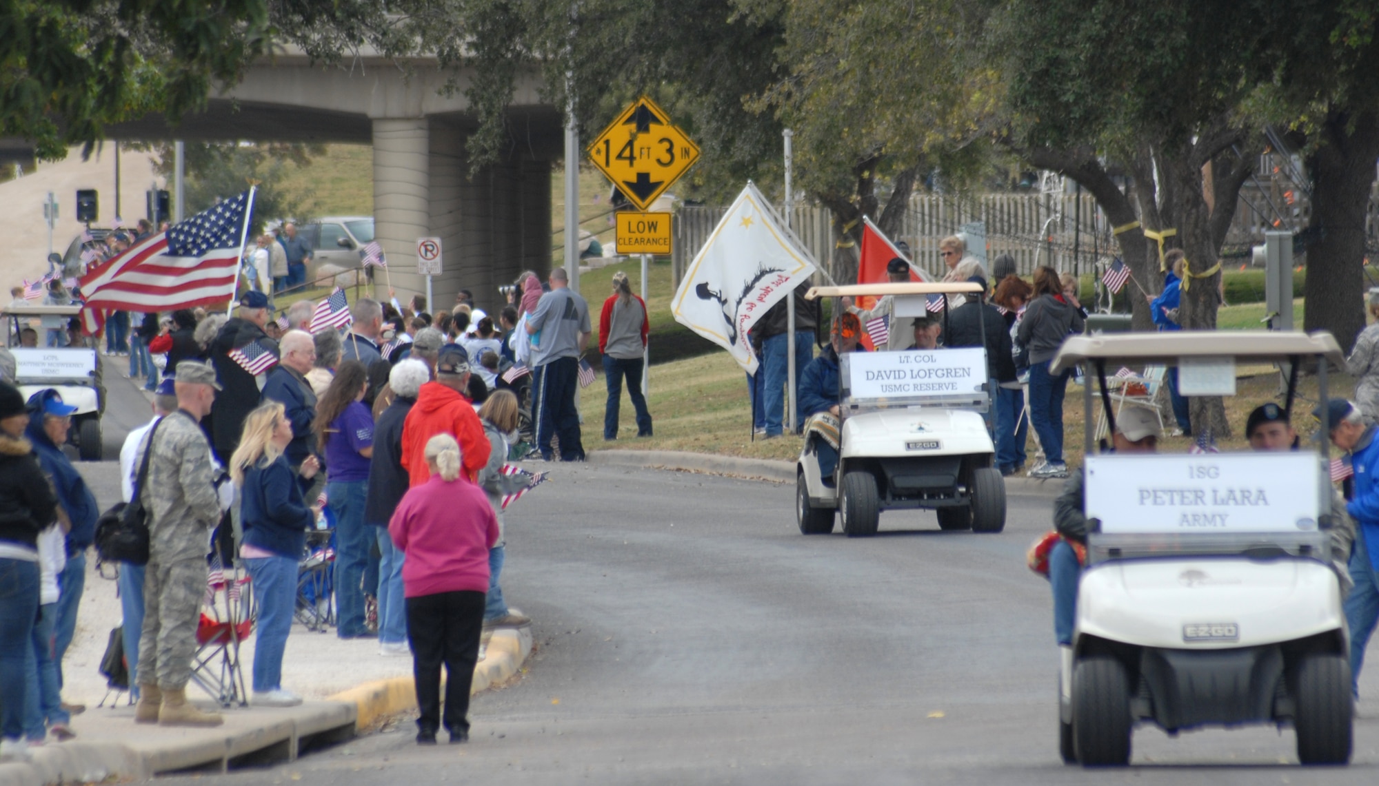Wounded warriors are driven in golf carts by Soldiers, Sailors, Airmen and Marines from Goodfellow AFB, Texas in a Hunt for Heroes parade through San Angleo on Nov. 20.  25 wounded veterans took part in the annual Hunt for Heroes event in West Texas, hosted by the Show of Support Military Hunt Inc., a nonprofit organization.  The criteria for the hunt are the veterans have to be wounded or disfigured and discharged from the military. (U.S. Air Force photo/Robert D. Martinez)