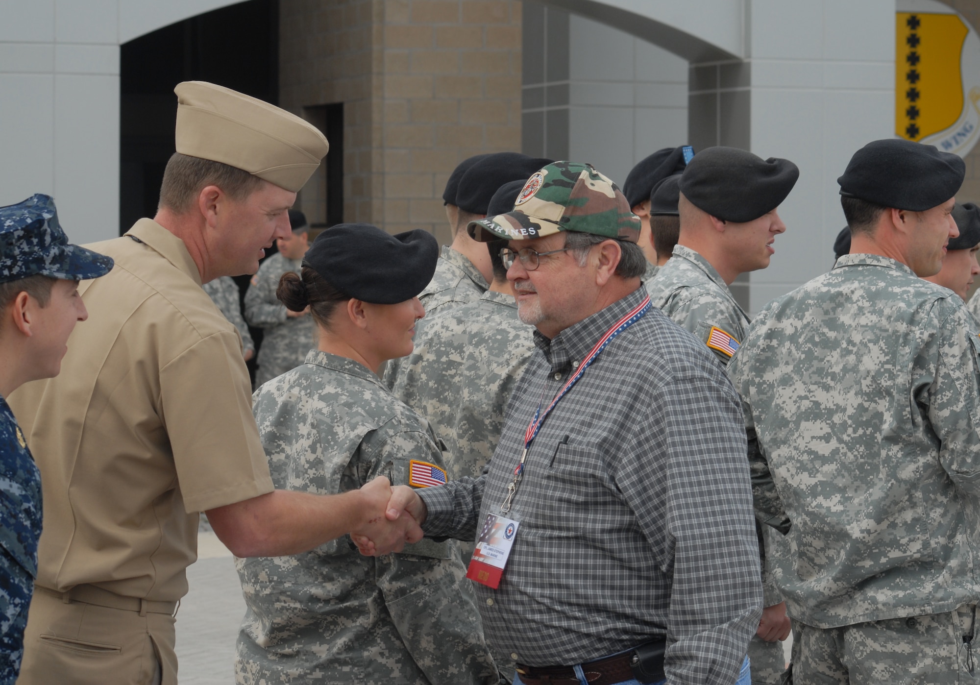 Marine Corporal James Rickey Stephens, shakes the hands of Sailors during a visit to Goodfellow AFB, Texas on Nov. 20.  Corporal Stephens is a wounded veteran taking part in the annual Hunt for Heroes event in West Texas, hosted by the Show of Support Military Hunt Inc., a nonprofit organization The criteria for the hunt are the veterans have to be wounded or disfigured and discharged from the military. (U.S. Air Force photo/Robert D. Martinez)