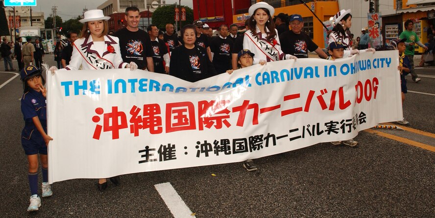 Col. Lenny Richoux, 18th Wing vice commander, takes part in a parade  at the Okinawa International Carnival Nov. 21-22 just outside of Gate 2 at Kadena Air Base, Japan. The cultural event brought together many of the different cultures that exist on Okinawa through a colorful parade, tug-of-war, a variety of performances and exotic foods. This is an annual event which highlights the city’s international culture. 
 (U.S. Air Force photo/Tech. Sgt. Reynaldo Ramon)
