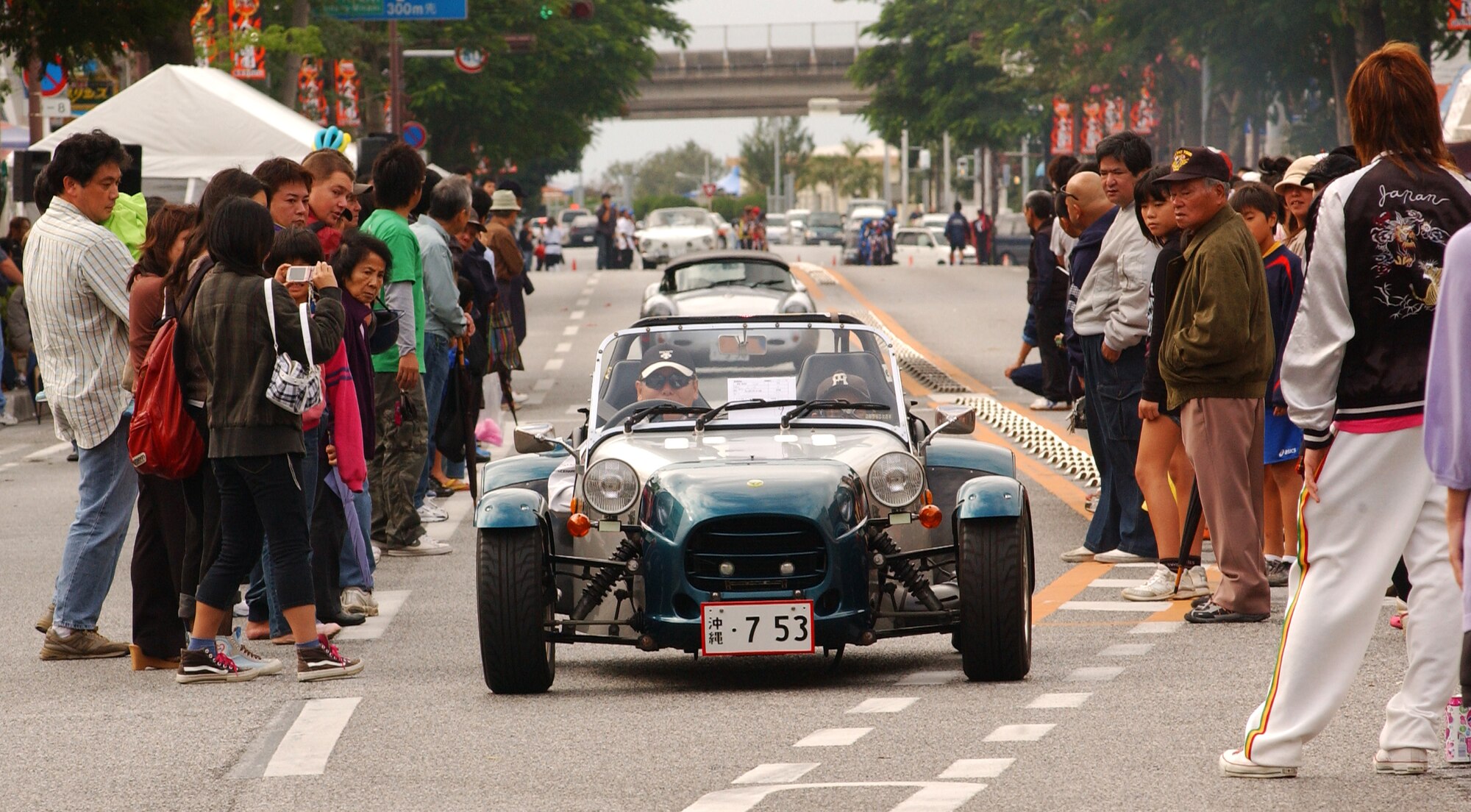 Okinawans and Americans get a glimpse of the "Oldy" cars being displayed at the Okinawa International Carnival Nov. 21-22 just outside of Gate 2 at Kadena Air Base, Japan. The cultural event brought together many of the different cultures that exist on Okinawa through a colorful parade, tug-of-war, a variety of performances and exotic foods. This is an annual event which highlights the city’s international culture. 
(U.S. Air Force photo/Tech. Sgt. Reynaldo Ramon) 
