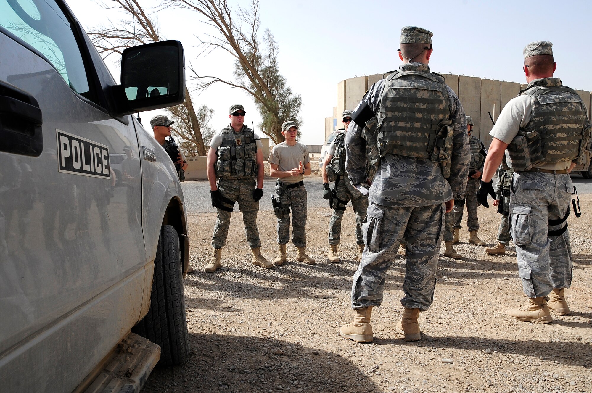 ALI BASE, Iraq -- U.S. Air Force members of the 732 Provost Marshall Office/ Det 5, conduct a debriefing following the termination an active shooter scenario at the combat support hospital here, Nov. 19, 2009. The scenario is designed to help train PMO members on responding to emergency situations involving an active gunman. (U.S. Air Force photo/ Senior Airman Tony R. Ritter)