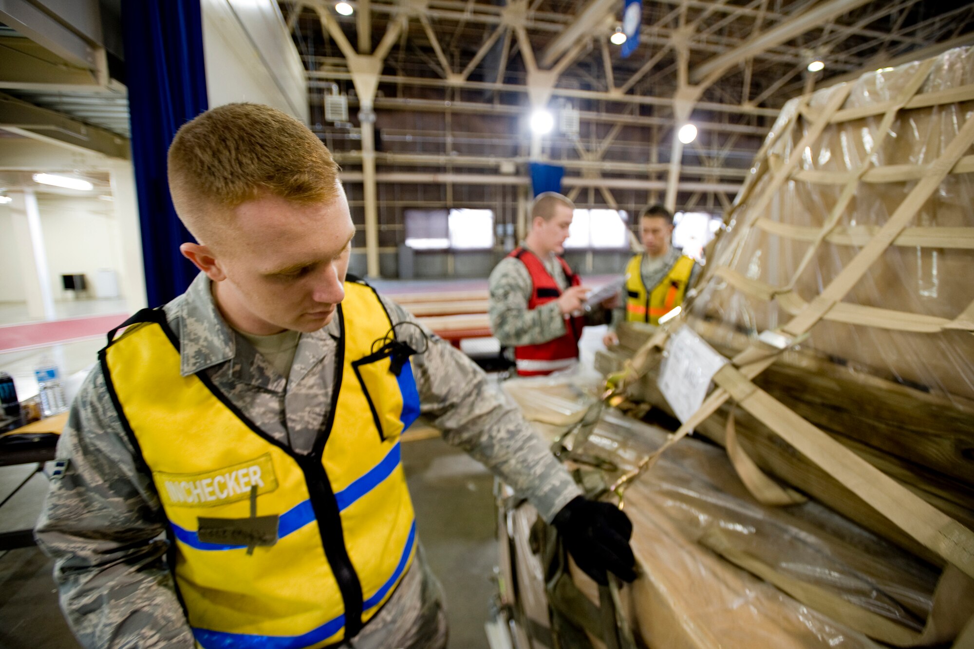 MISAWA AIR BASE, Japan -- Airman 1st Class Kurt Ranes, 35th Maintenance Squadron test cell journeyman, checks cargo straps during cargo deployment function training Nov. 20 at Hanger 949. Airman Ranes has been a member of the CDF for one year and has helped the team in four deployment exercises and two real-world deployments. (U.S. Air Force photo/Senior Airman Jamal D. Sutter)