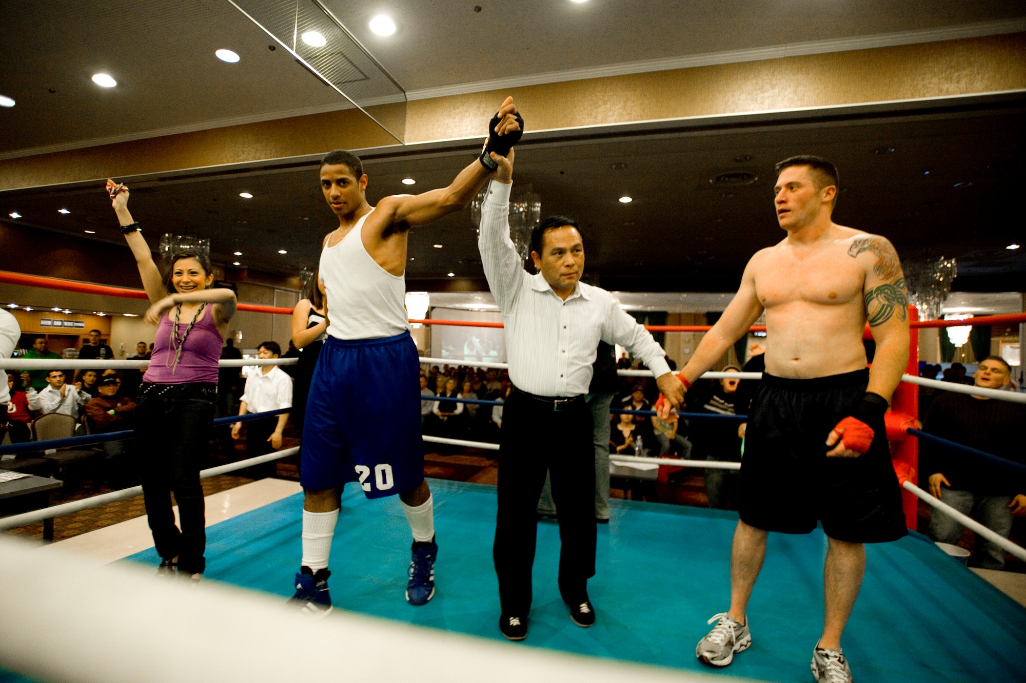 MISAWA AIR BASE, Japan -- Sydney Sullivan, a Washington, D.C., native, stands victorious after his Friday Night Fight Night welterweight bout against Nathan Shaw, a Gilmore, Texas, native, Nov. 20 at the Collocated Club. The event allowed fighters to showcase their boxing skills in front of family, friends and co-workers. (U.S. Air Force photo/Senior Airman Jamal D. Sutter)