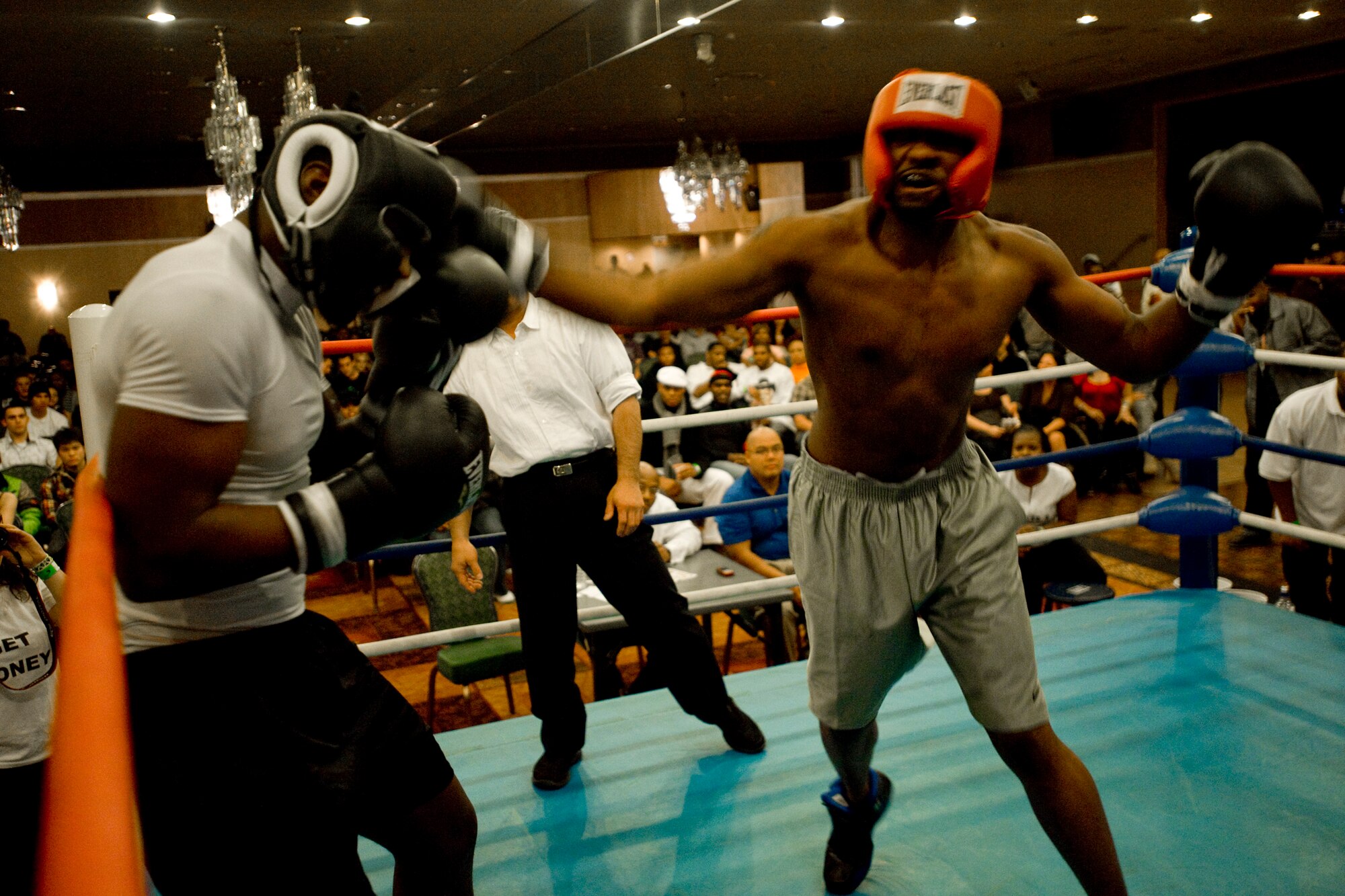 MISAWA AIR BASE, Japan -- Jeremiah Walker, a Youngtown, Ohio, native, lands a right haymaker against Billy White, a Jacksonville, Texas, native, during their Friday Night Fight Night bout Nov. 20 at the Collocated Club. Despite his effort, Walker lost the light heavyweight fight to White. (U.S. Air Force photo/Senior Airman Jamal D. Sutter)
