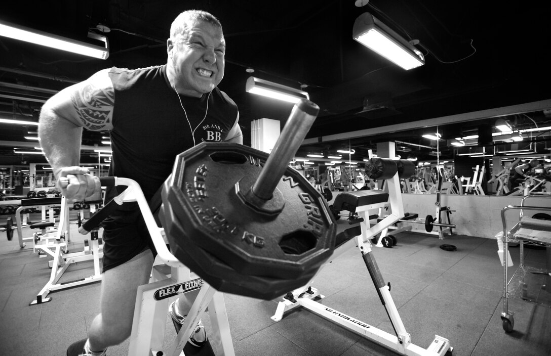 Cpl. John Smurr, a senior Marine Corps body bearer, works out his back muscles during an off day, Nov. 24, 2009. Body bearers carry the remains of fallen Marines to their final resting place in Arlington and surrounding cemeteries in the National Capital Region.