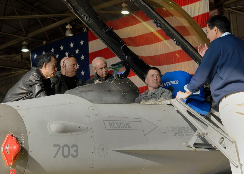 Col. Robert Givens, 8th Fighter Wing commander, briefs Robin Campaniano, Anthony Guerrero, Jr., Les Enderton and Steven Ai on f-16 cockpit procedures Nov. 23. The group of Air Force Civilian Advisory Committee members are touring Kunsan and Osan Air Bases, ROK, Nov. 21-26  The purpose of the trip is for General North to celebrate Thanksgiving with the Airmen and to provide the civic leaders a better understanding of life for Airmen assigned to the ROK. (U.S. Air Force photo/Tech. Sgt. Jerome S. Tayborn) 