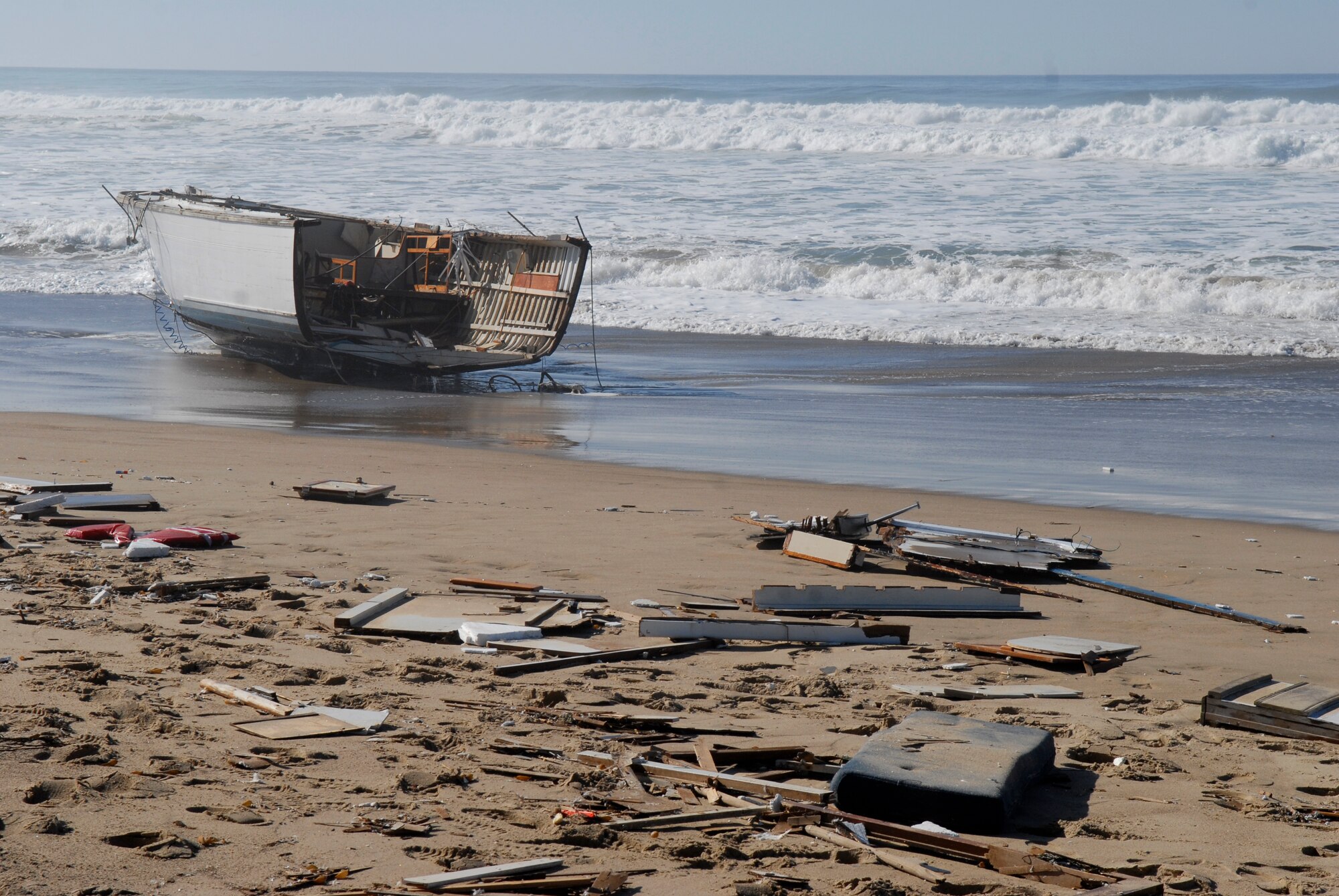 VANDENBERG AIR FORCE BASE, Calif. – Washed ashore, wreckage is left behind after a boating accident that occurred at Minuteman Beach here Tuesday, Nov. 24, 2009. Vandenberg’s emergency responders have reported one dead and one injured survivor from the boating accident off of the coast of Minuteman Beach. (U.S. Air Force photo/Senior Airman Andrew Satran)   