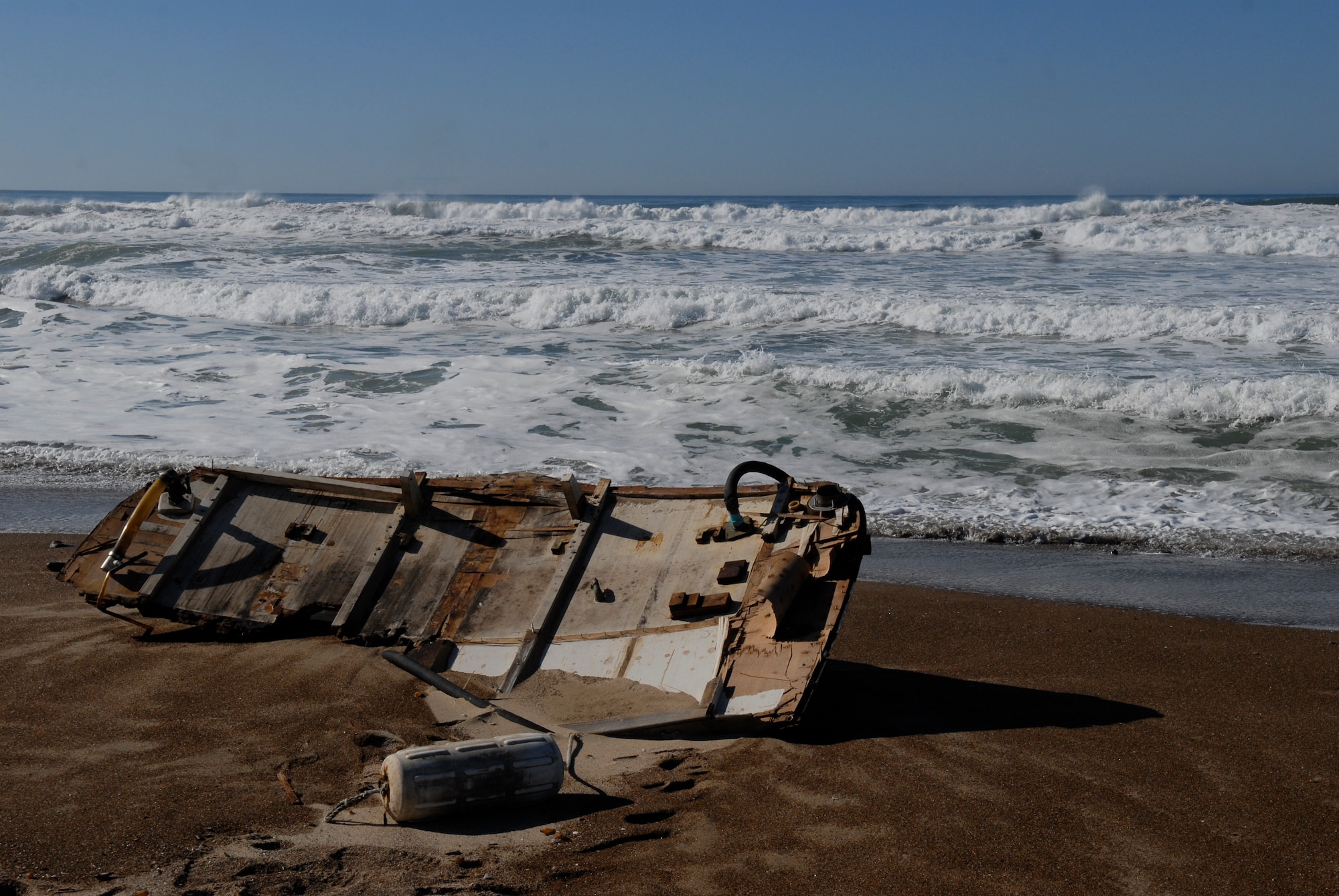VANDENBERG AIR FORCE BASE, Calif. – Washed ashore, wreckage is left behind after a boating accident that occurred at Minuteman Beach here Tuesday, Nov. 24, 2009. Vandenberg’s emergency responders have reported one dead and one injured survivor from the boating accident off of the coast of Minuteman Beach. (U.S. Air Force photo/Senior Airman Andrew Satran)   