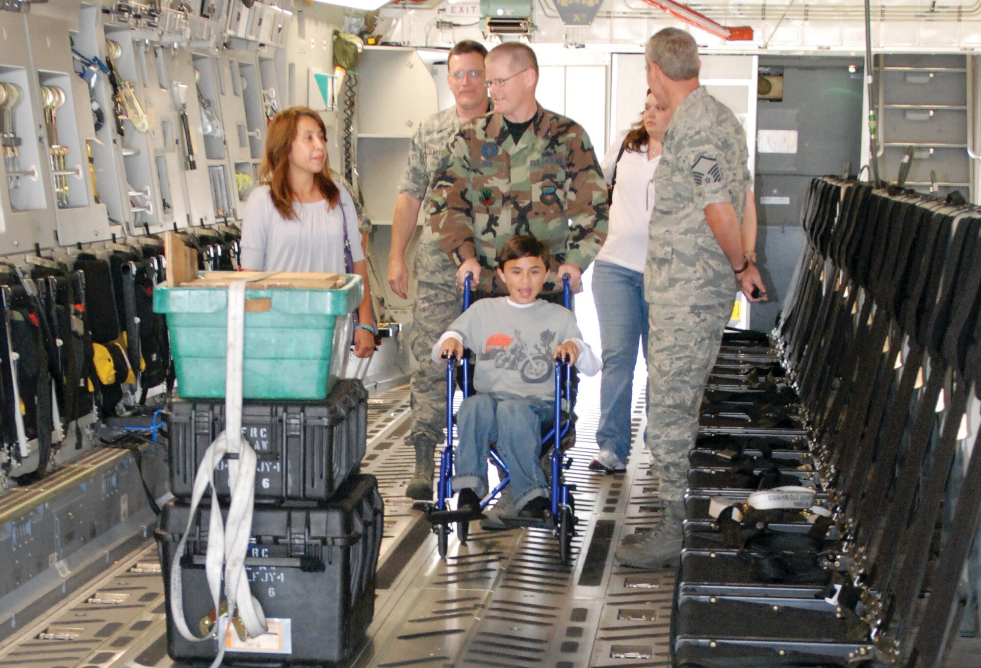 David Woodward and his family tour a C-17. (U.S. Air Force photo by Staff Sgt. Megan Crusher)