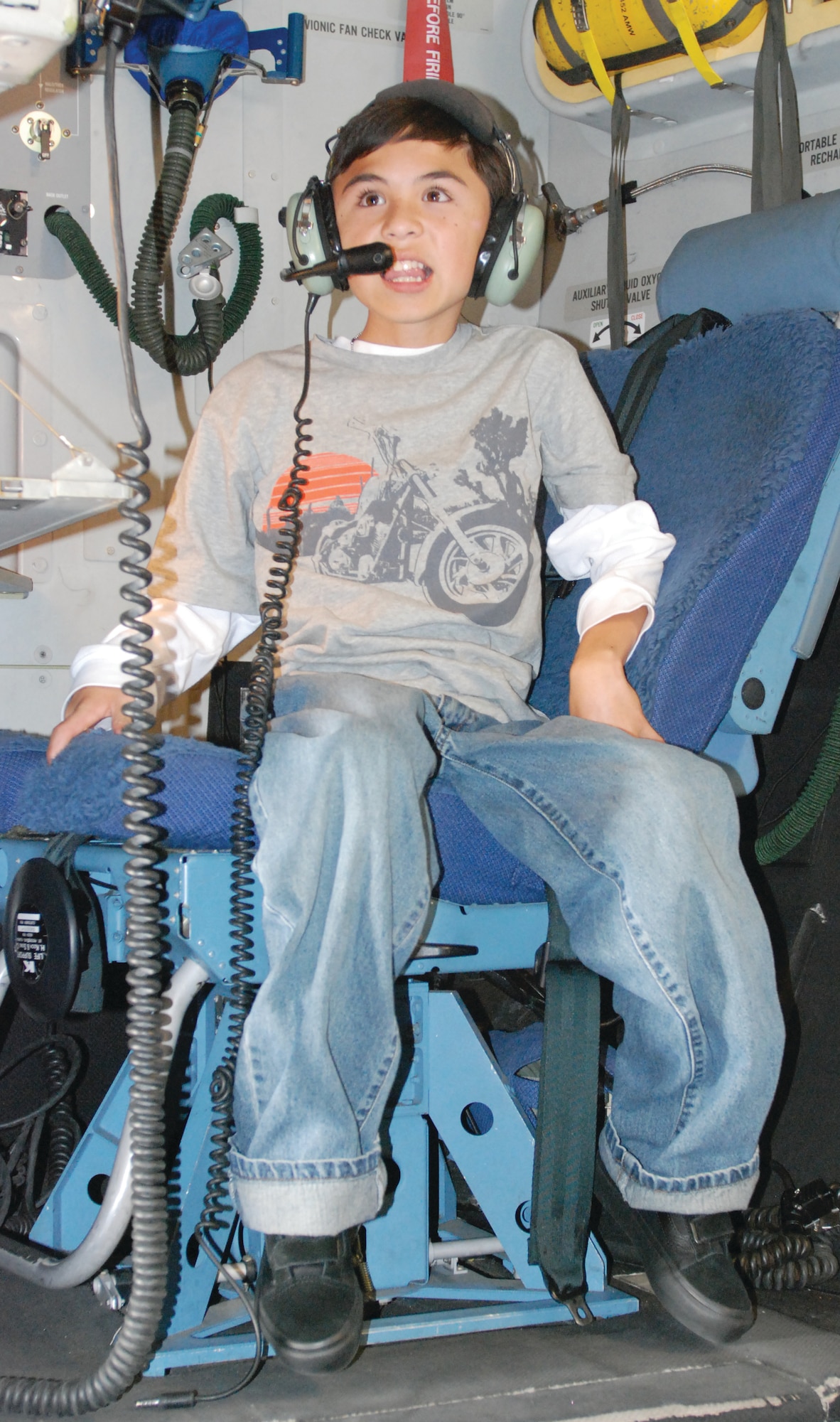 David Woodward, a 12-year-old Costa Mesa boy with muscular dystrophy, tests out the loadmaster station in a C-17 during his Make-a-Wish tour of March ARB Nov. 7. David was so excited about the people he met and aircraft during the tour that he was often speechless. (U.S. Air Force photo by Staff Sgt. Megan Crusher)